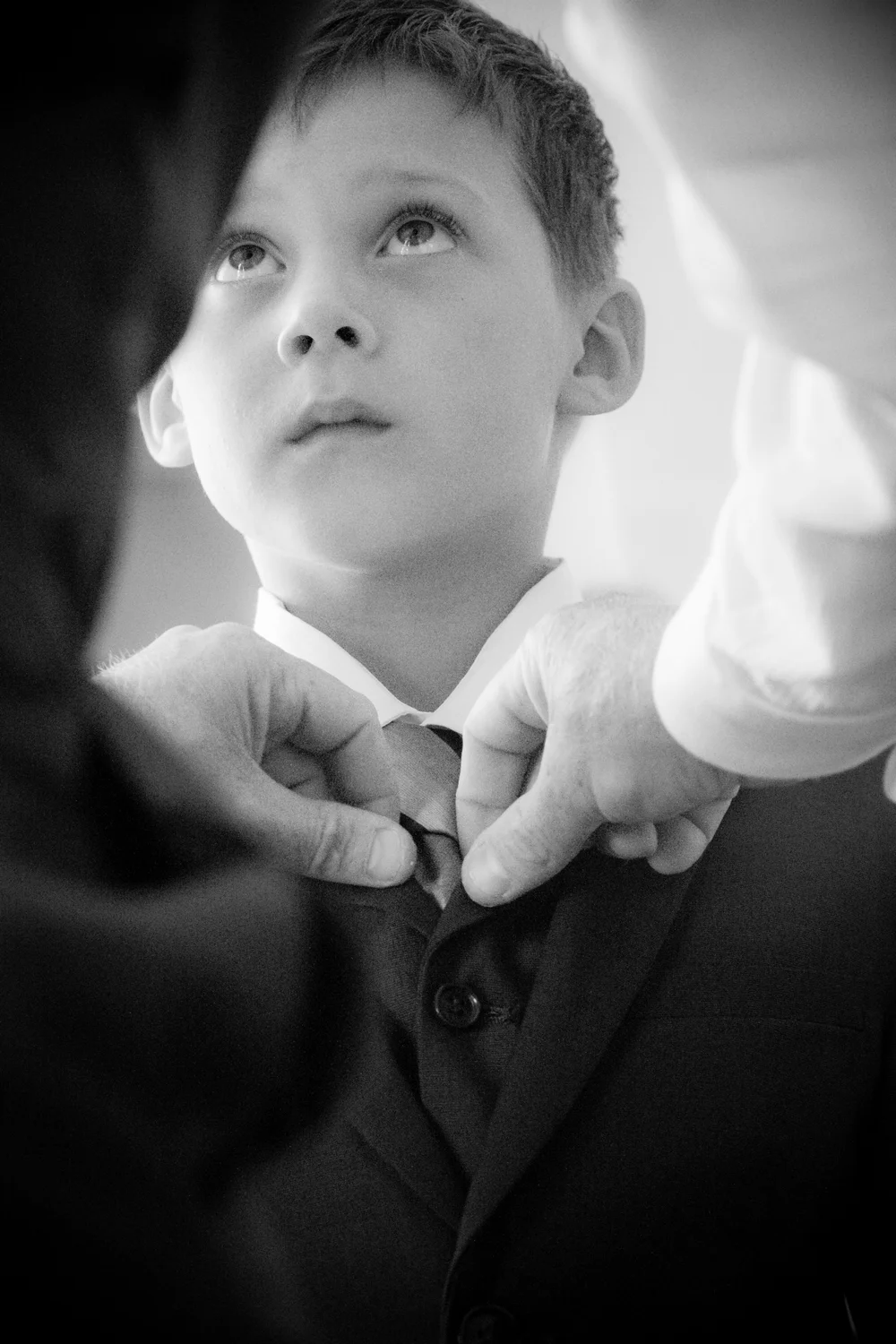 Helping with the tie.