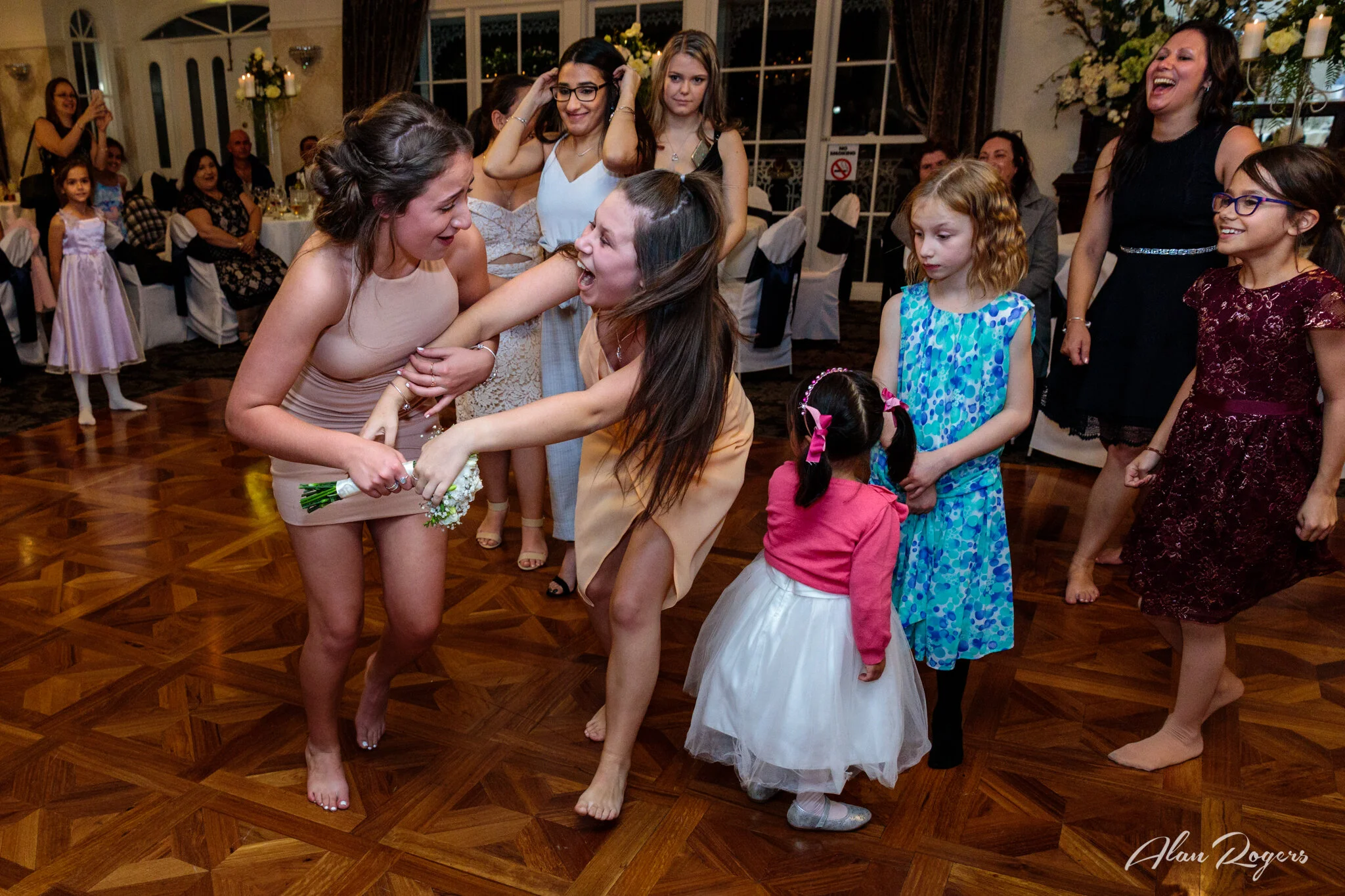 two-girls-catching-the-bouquet.jpg