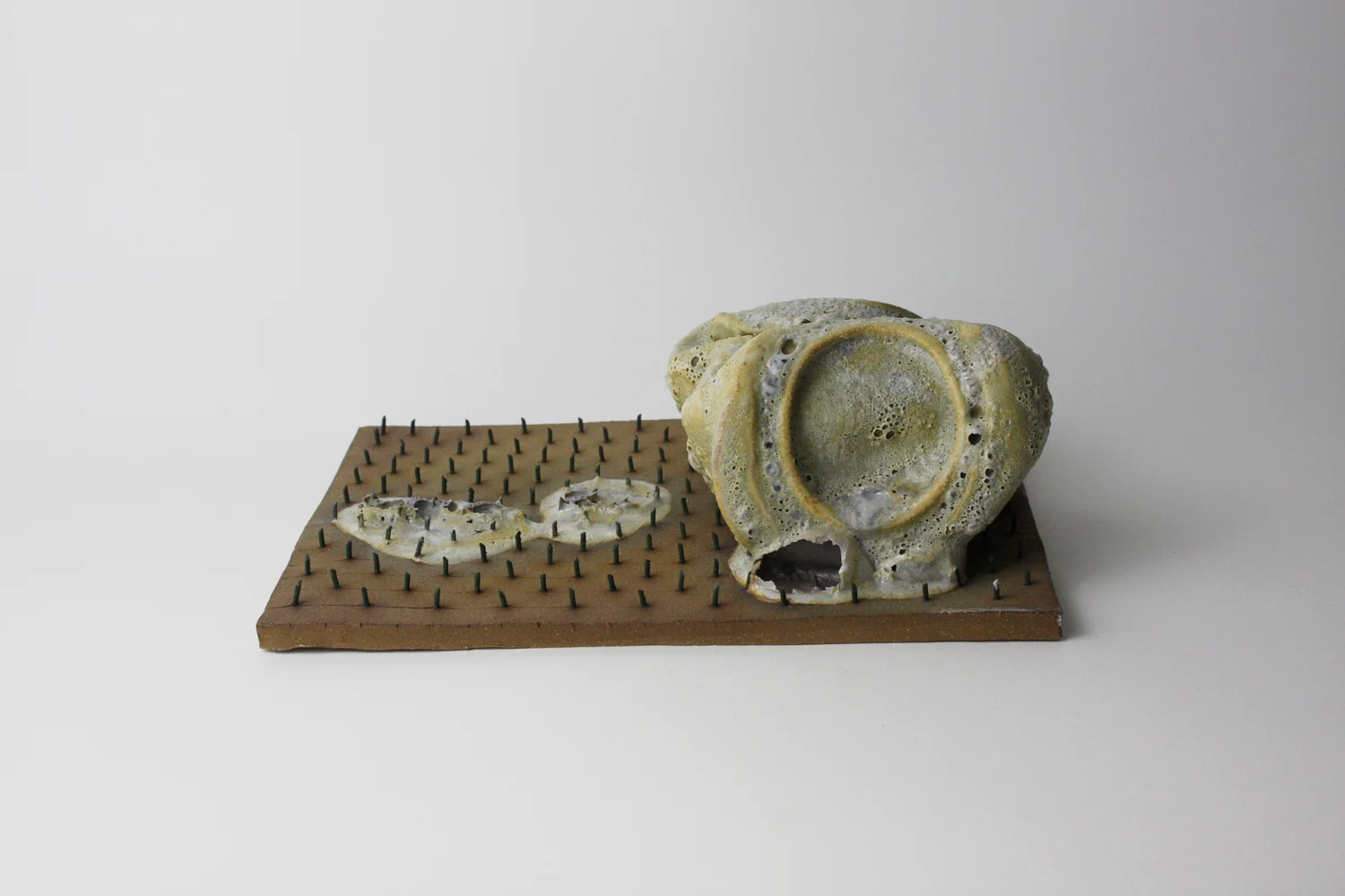  2015  3.5 x 10.25 x 7.5 inches  Glazed Ceramic and metal 
