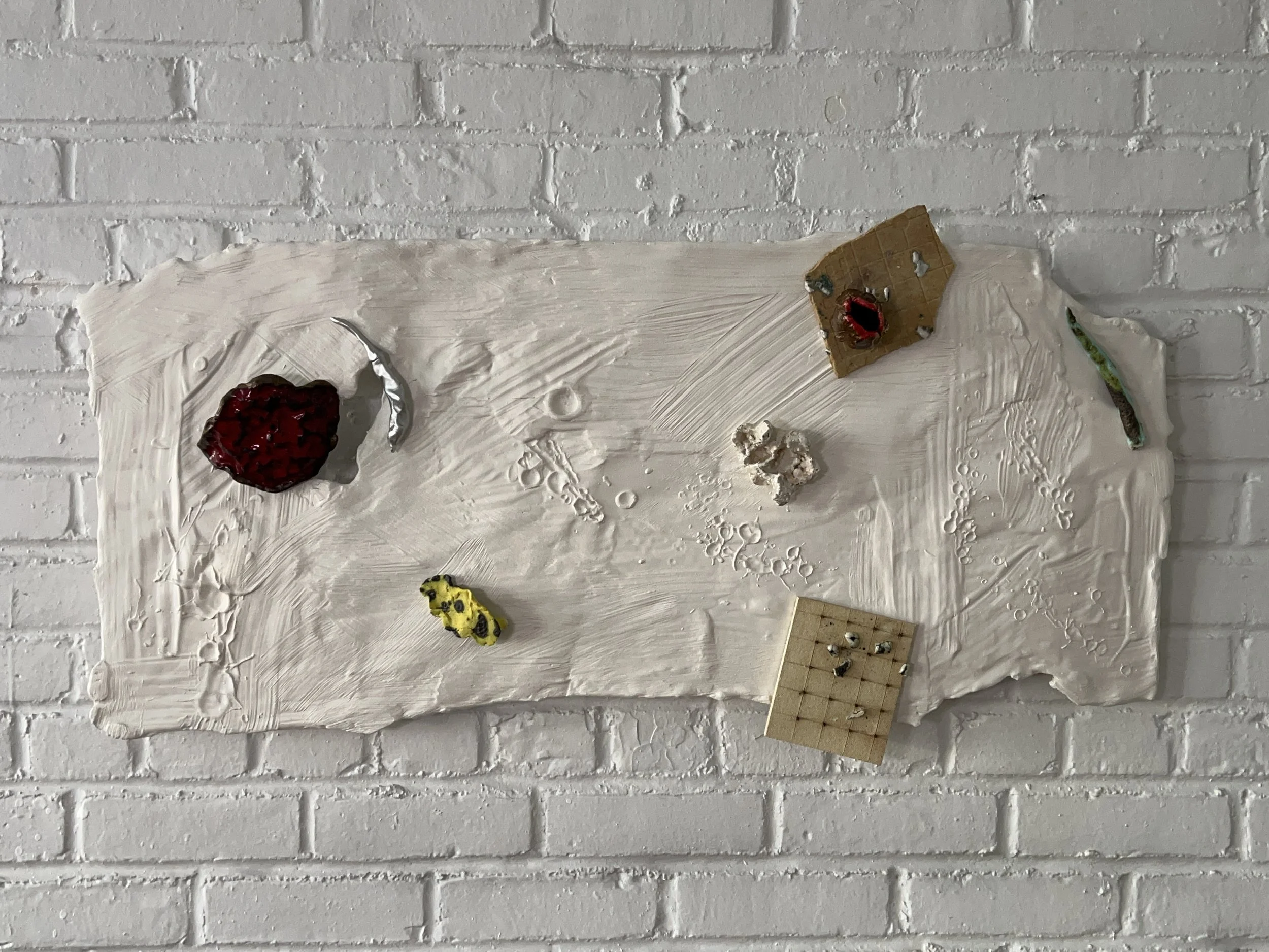  2024  Glazed ceramics, plaster, paint, epoxy, wood, paper, steel, metal wires  20 x 39 inches 