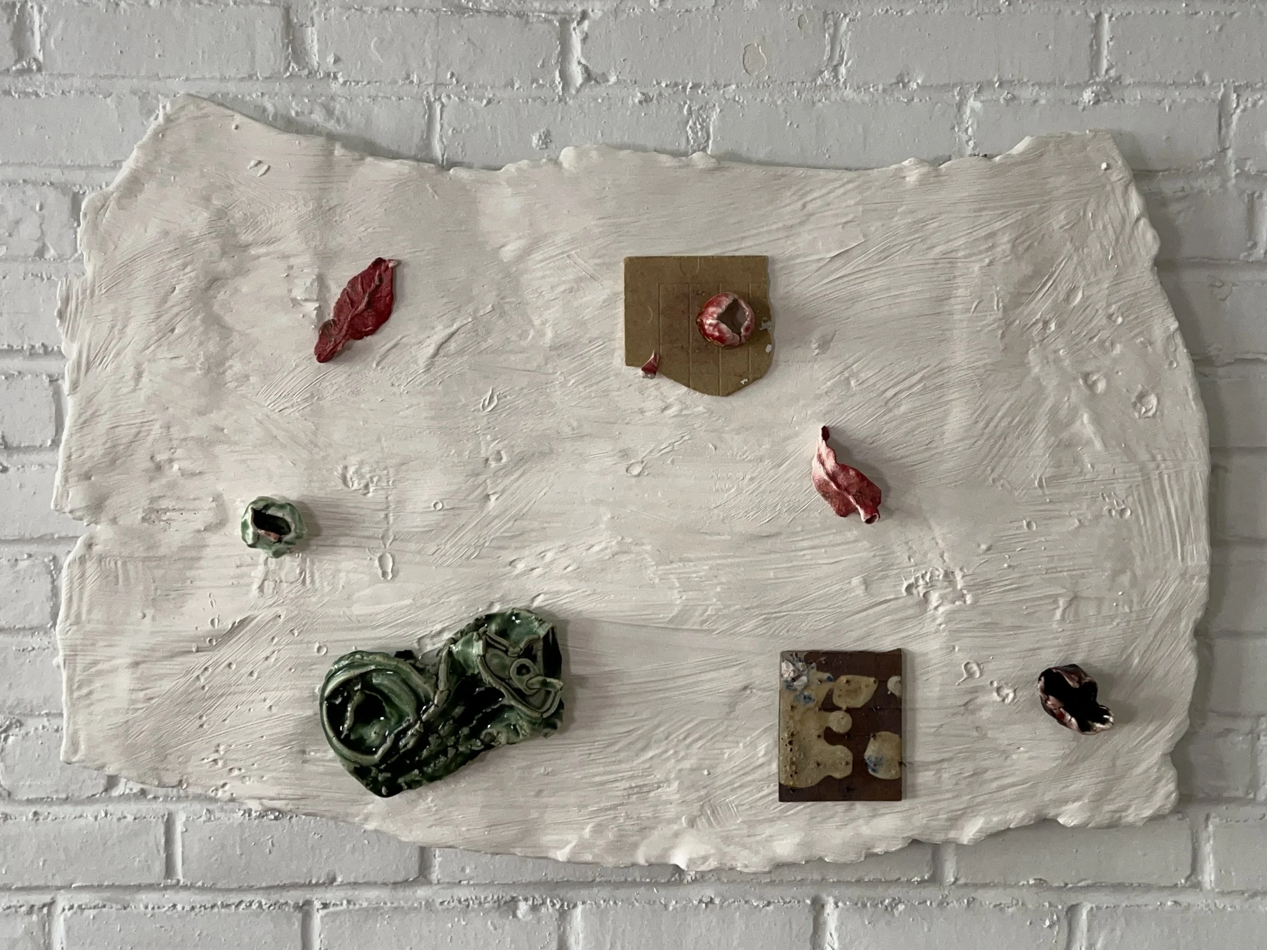  2024  Glazed ceramics, plaster, paint, epoxy, wood, paper, steel  24 x 37 inches 