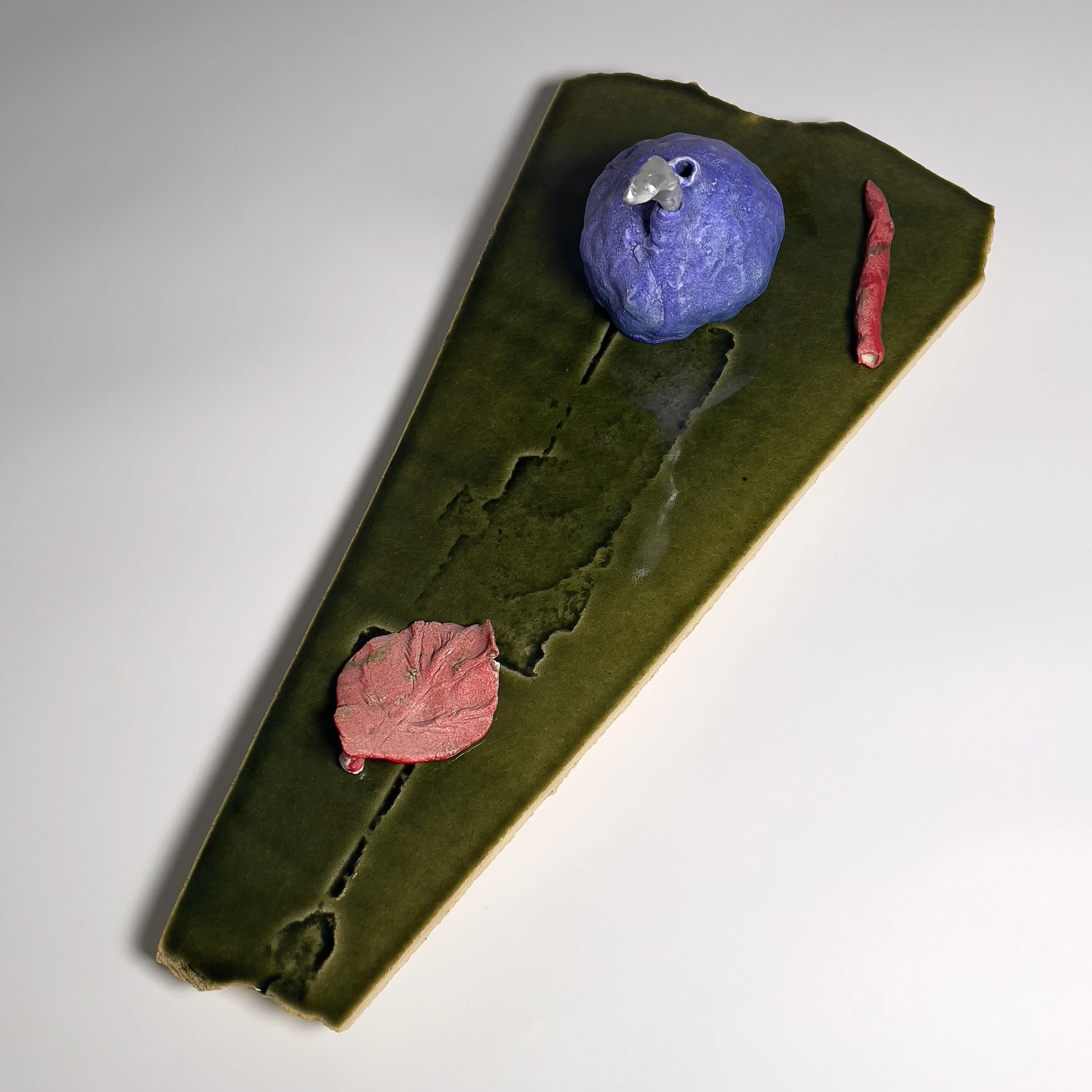  2025  Glazed ceramics, epoxy, metal wire, and silver spray paint  7.75 × 21.5 x 10.25 inches 