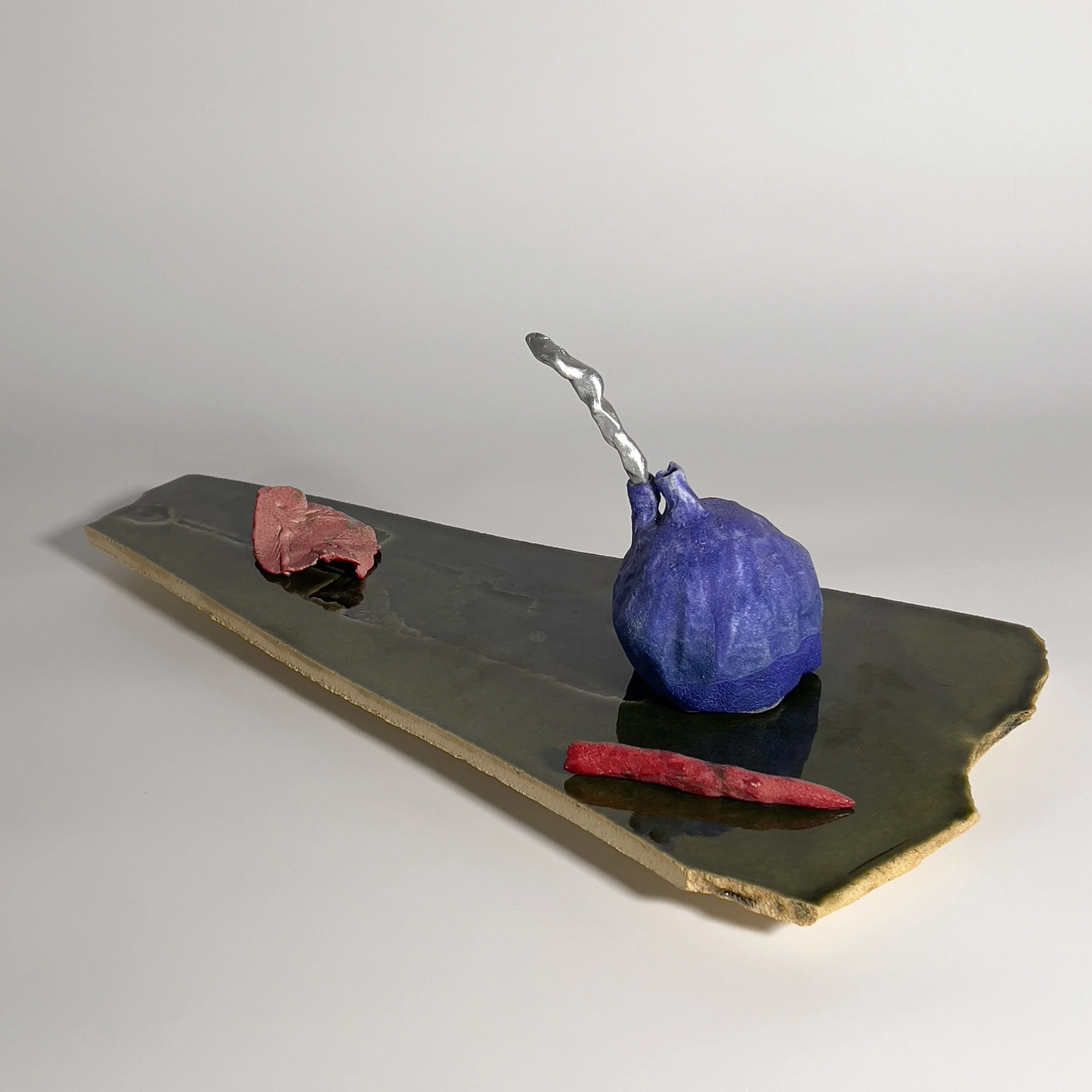  2025  Glazed ceramics, epoxy, metal wire, and silver spray paint  7.75 × 21.5 x 10.25 inches 