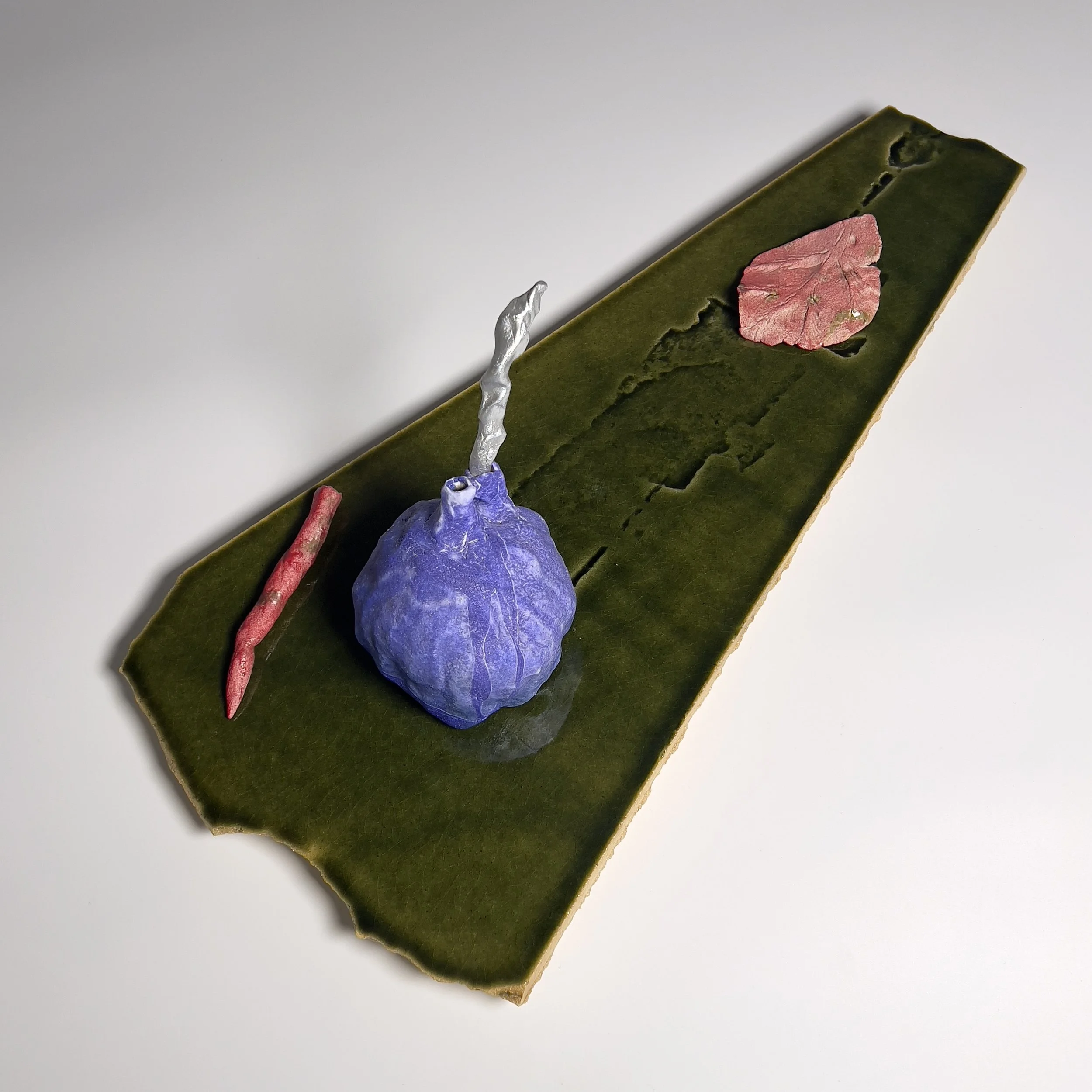  2025  Glazed ceramics, epoxy, metal wire, and silver spray paint  7.75 × 21.5 x 10.25 inches 