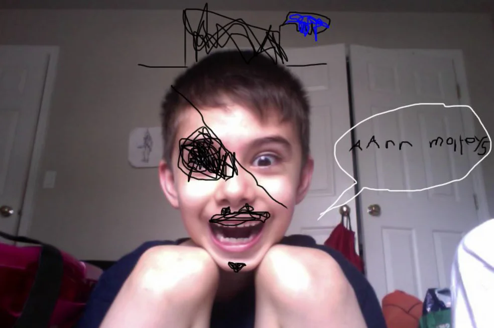 Joaquin playing with a pen drawing tablet. He's a pirate.