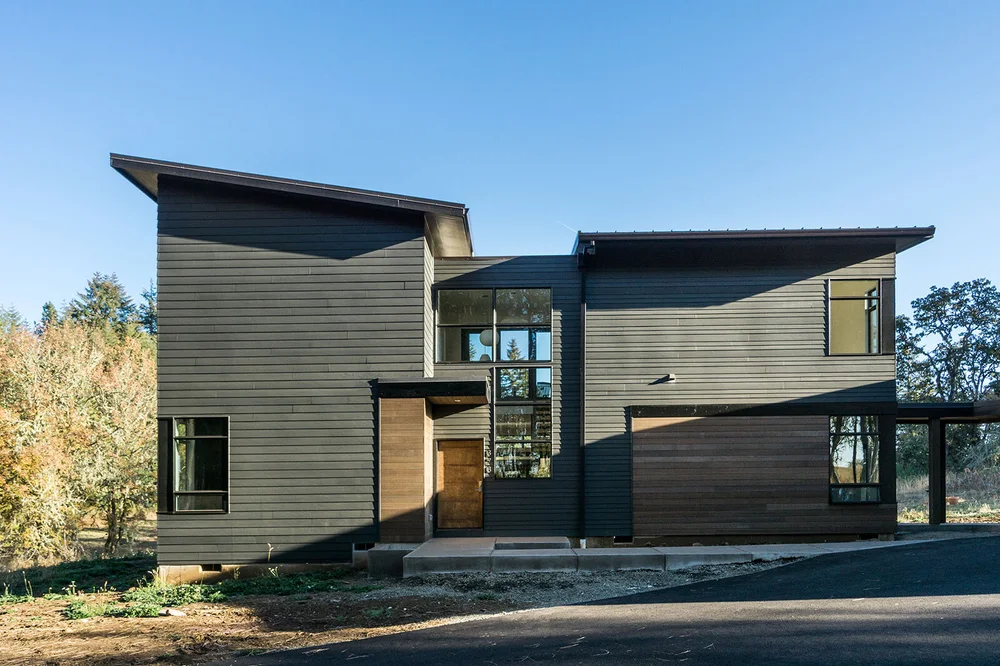Ridgewood Residence exterior with dark cladding and clean modern lines