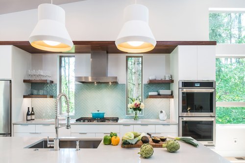 The range wall with floating walnut shelves