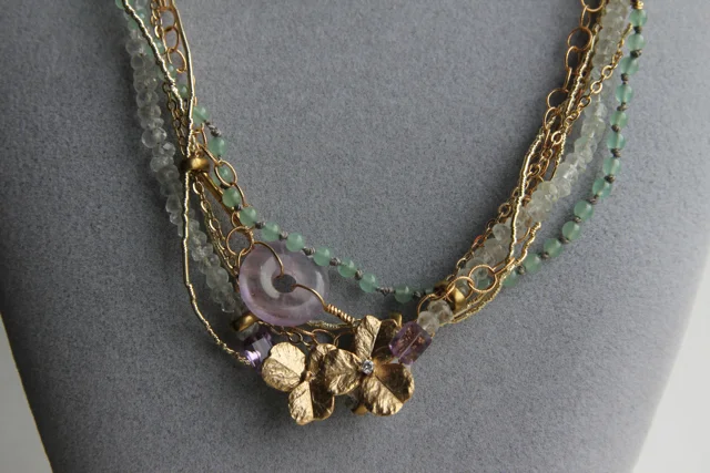 On Golden Pond (amethyst, aquamarine, jade, cubic zirconia, gold plated brass, silver thread, brass)