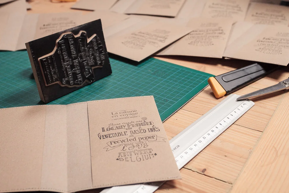 I drew this text by hand and had a stamp made out of it.