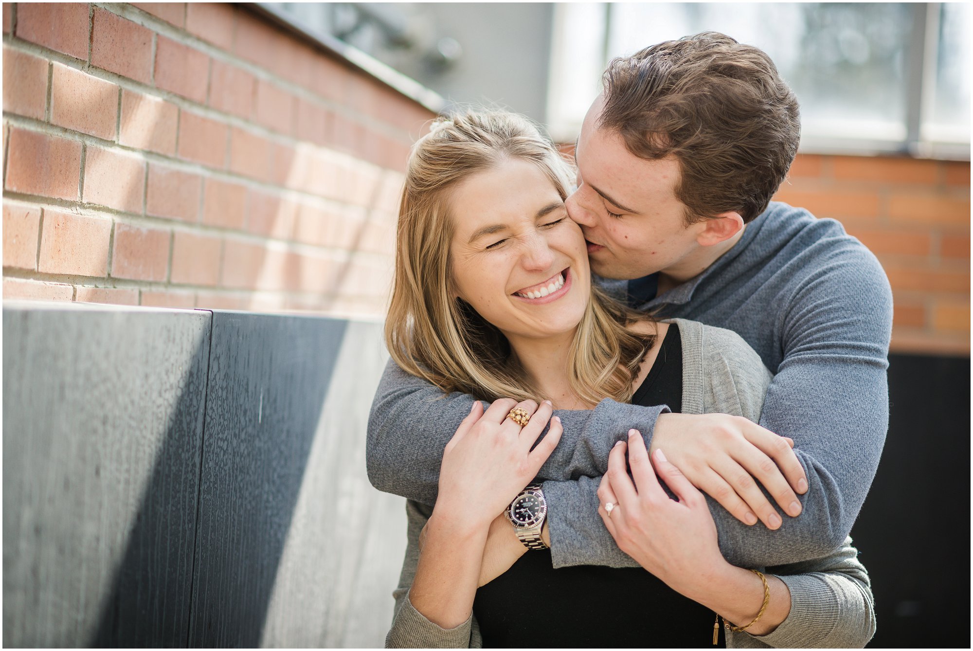  Groom kisses bride on the cheek during an Ann Arbor Engagement Session 