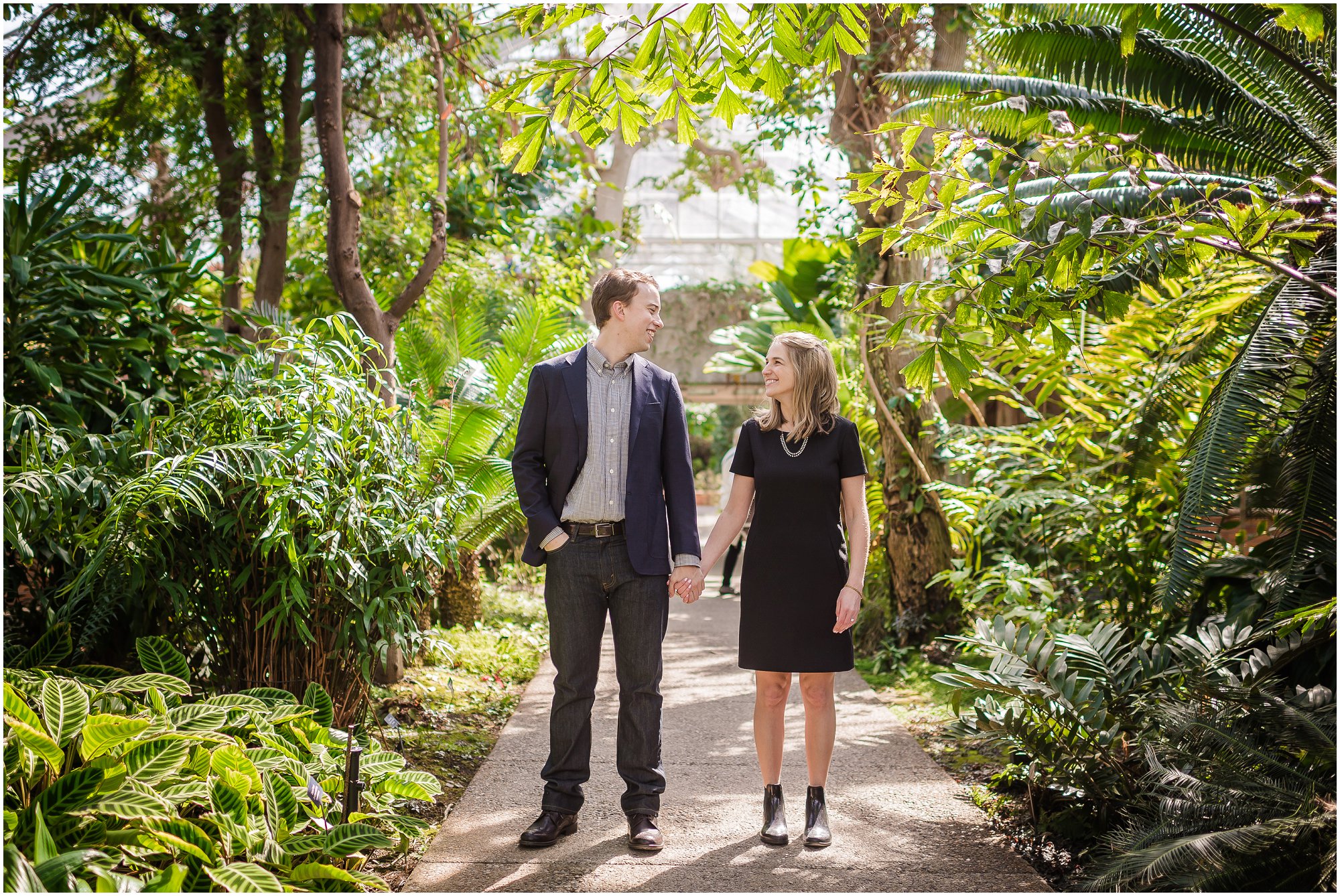  Fashionable couple holding hands in Matthaei Botanical Gardens Conservatory.&nbsp; 