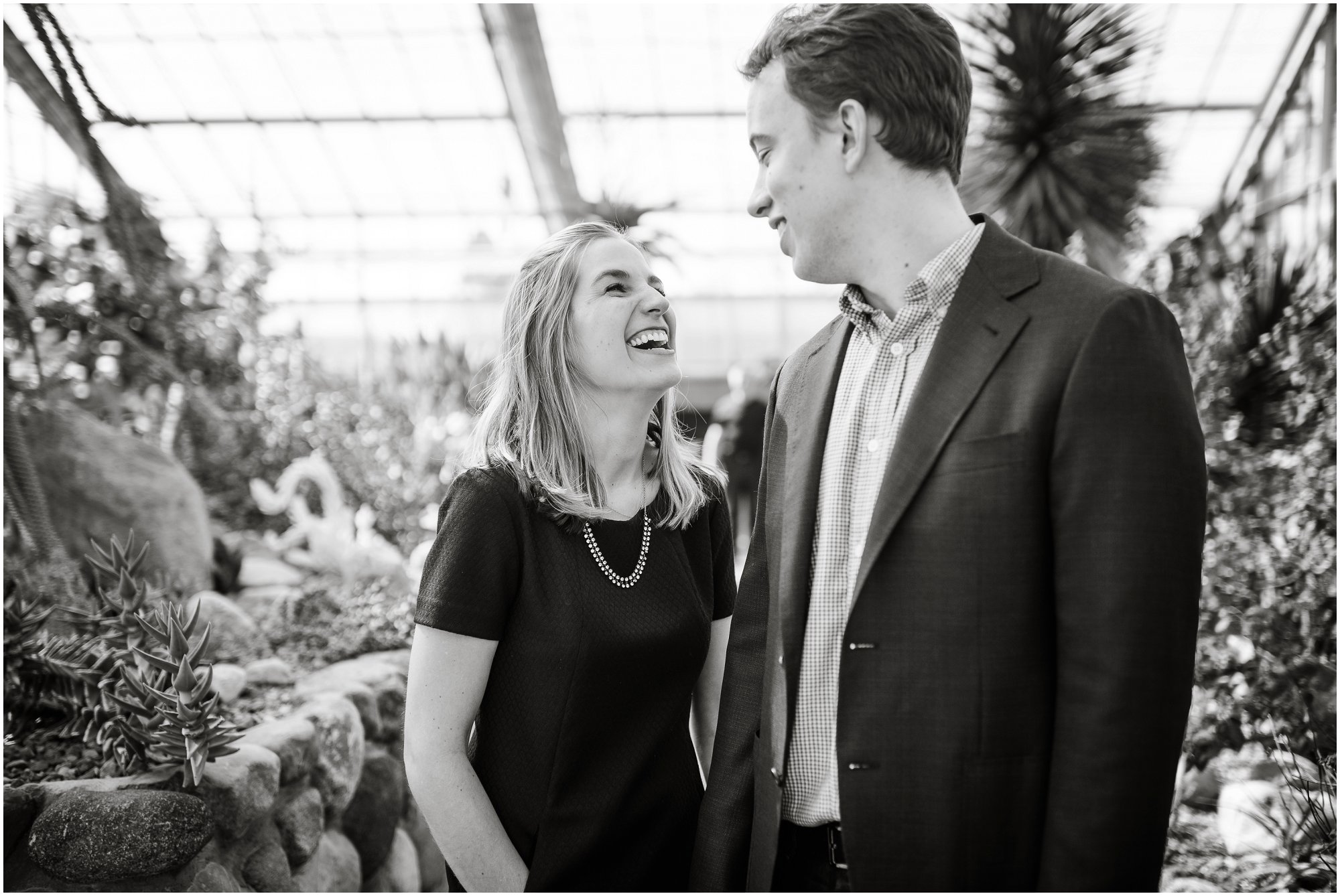  Bride laughing with groom in Matthai Botanical Garden's desert green house.&nbsp; 