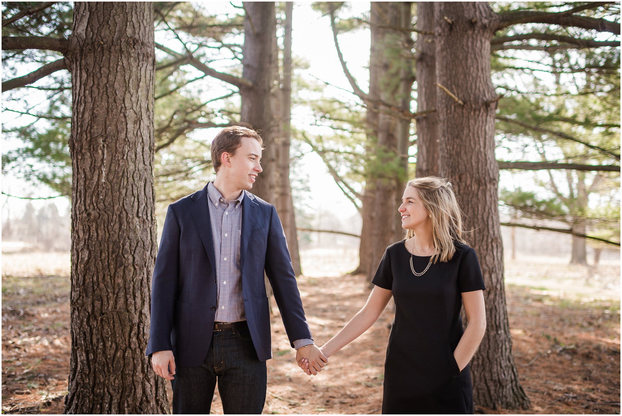  Couple walking out in the woods during Spring in Ann Arbor, Michigan.&nbsp; 