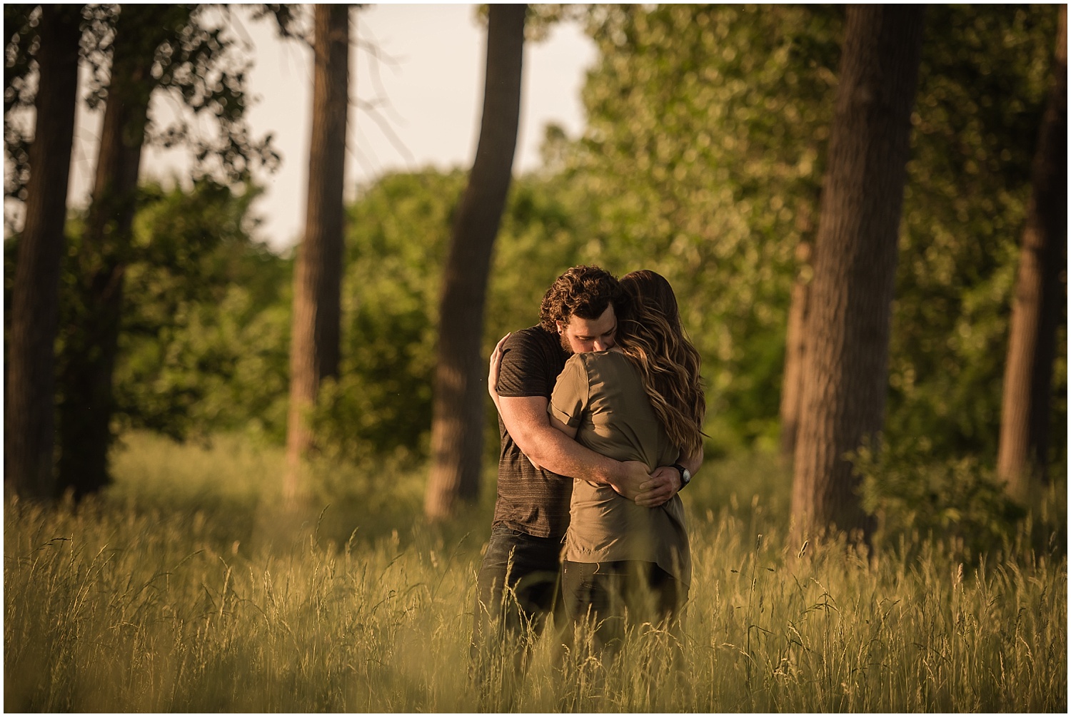  A couple embracing on a beach in Monroe, Michigan.  