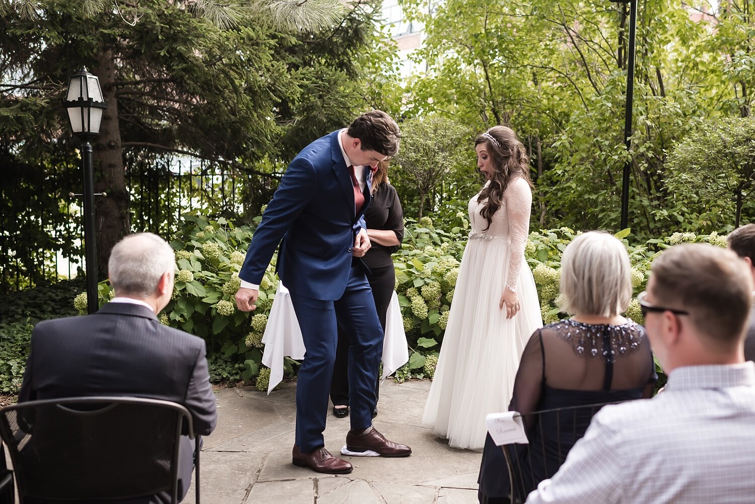  A man puts his foot down on a glass during his Jewish wedding.  