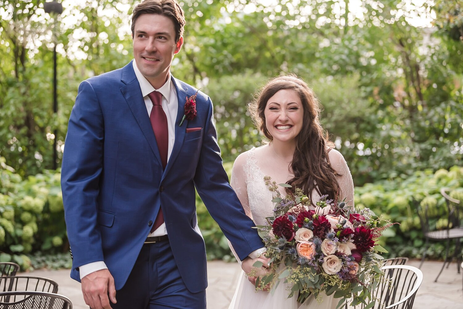  A couple walks towards the camera during their cocktail hour.  