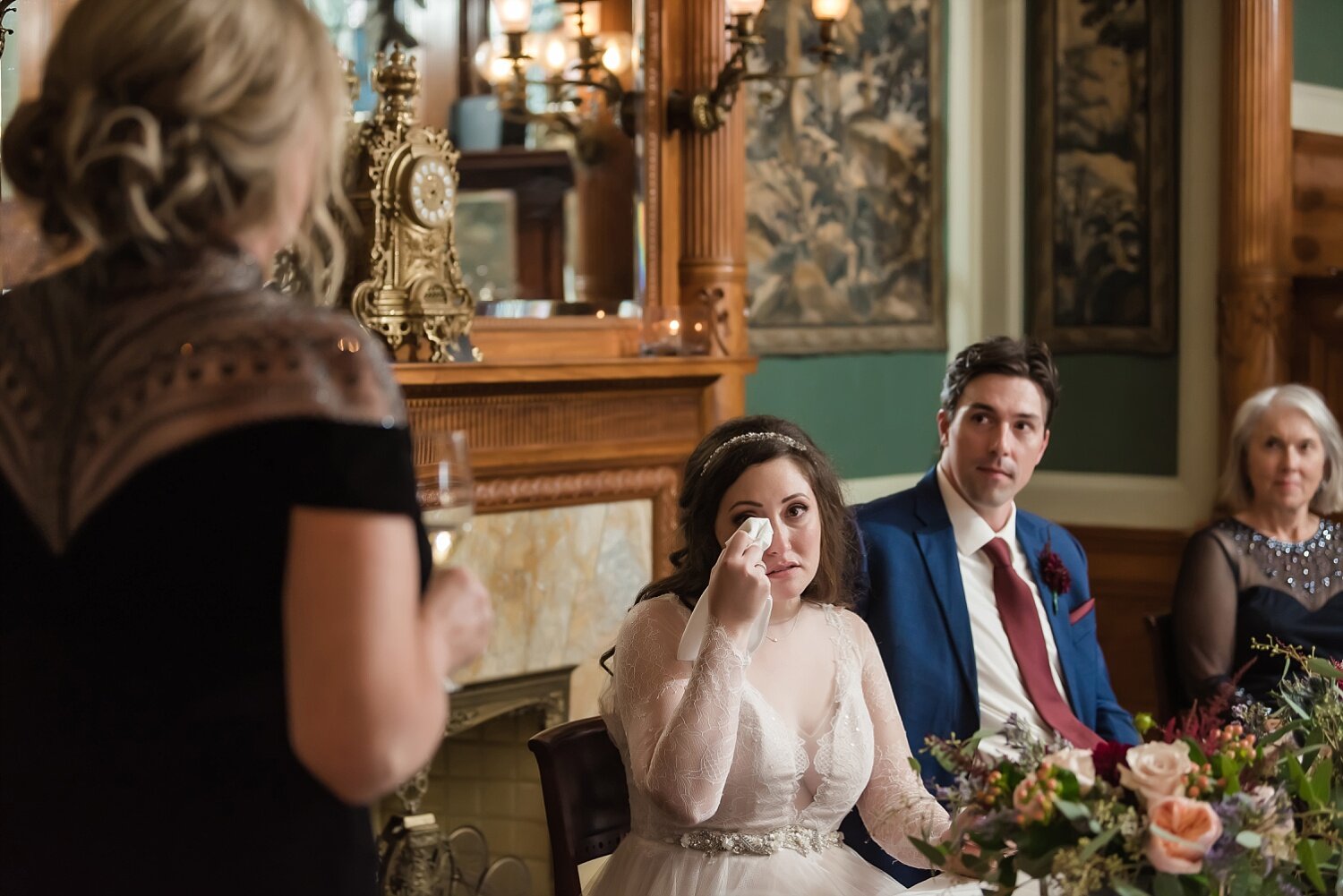  A bride tears up at her mother’s speech during her dinner party reception.  