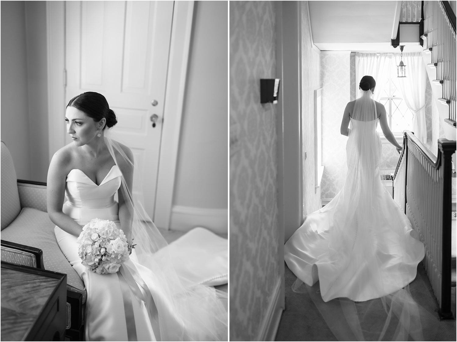  A bride looks out the window and walks down the stairs to do portraits on her wedding day.  