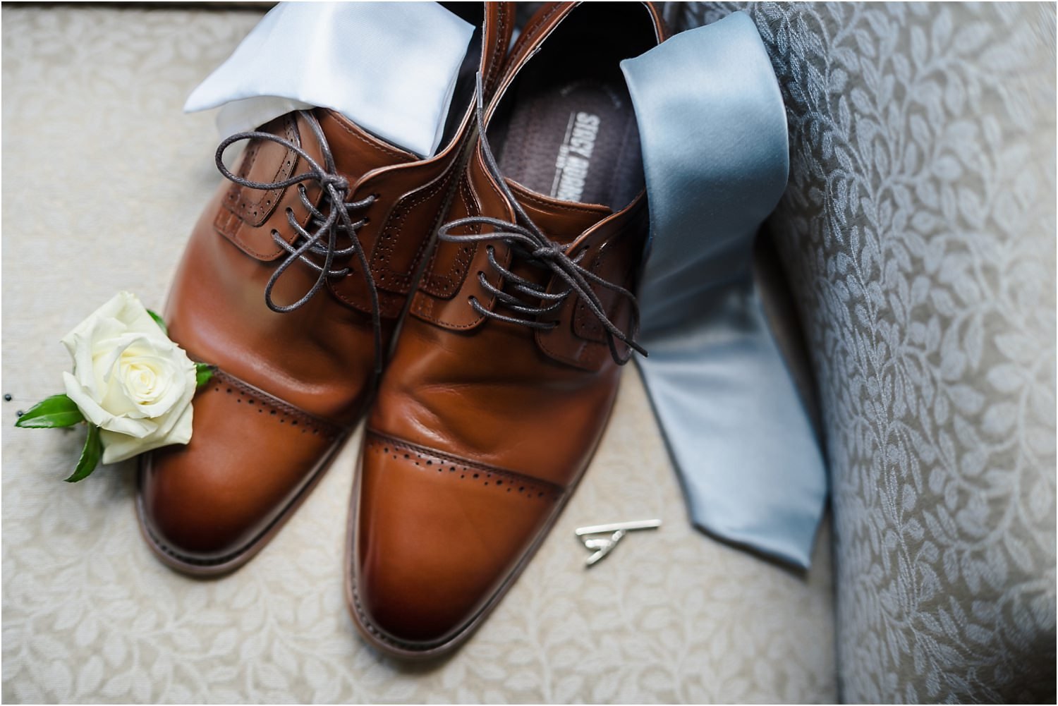  Detail shots of a groom’s accessories.  