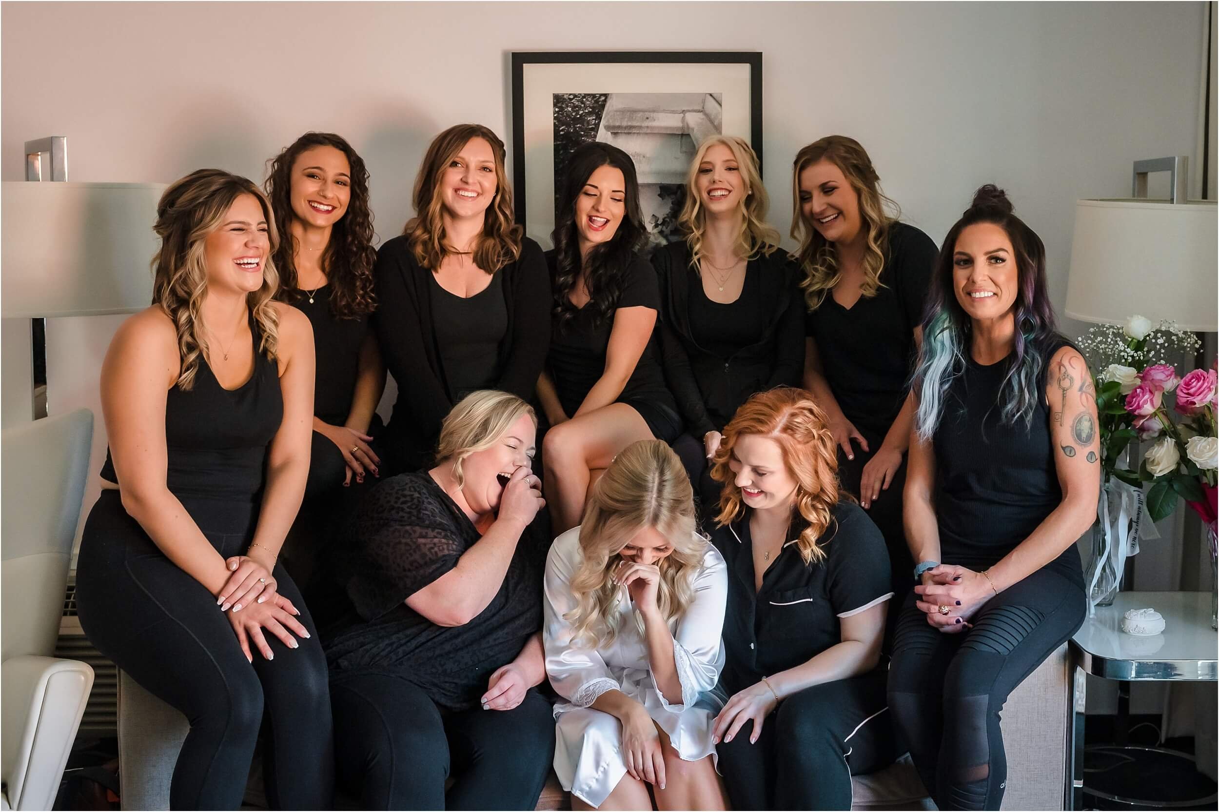  A bride and her bridesmaids laugh about a funny story at Webers Boutique Hotel in Ann Arbor.  