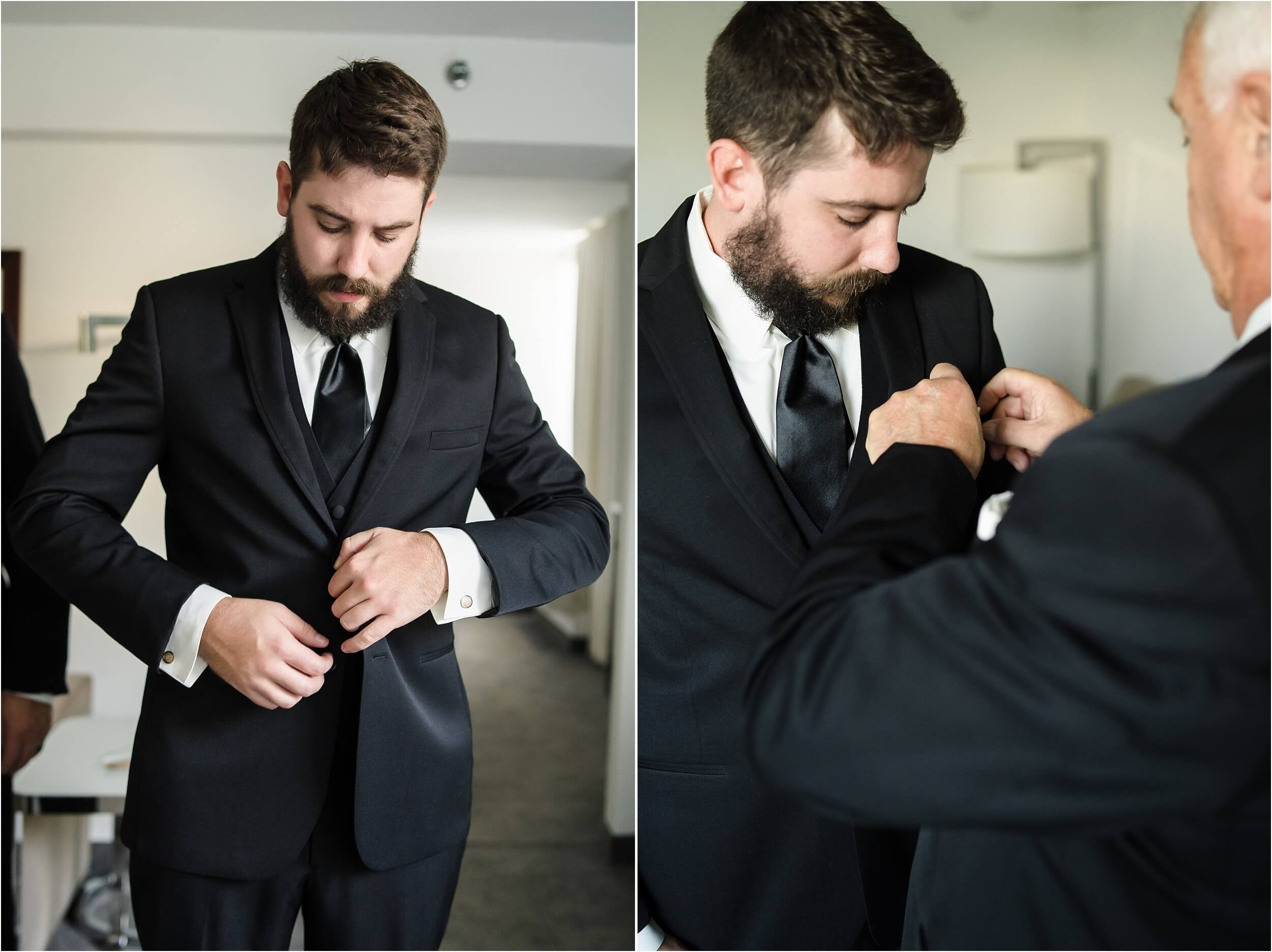  A groom buttoning up his jacket.  