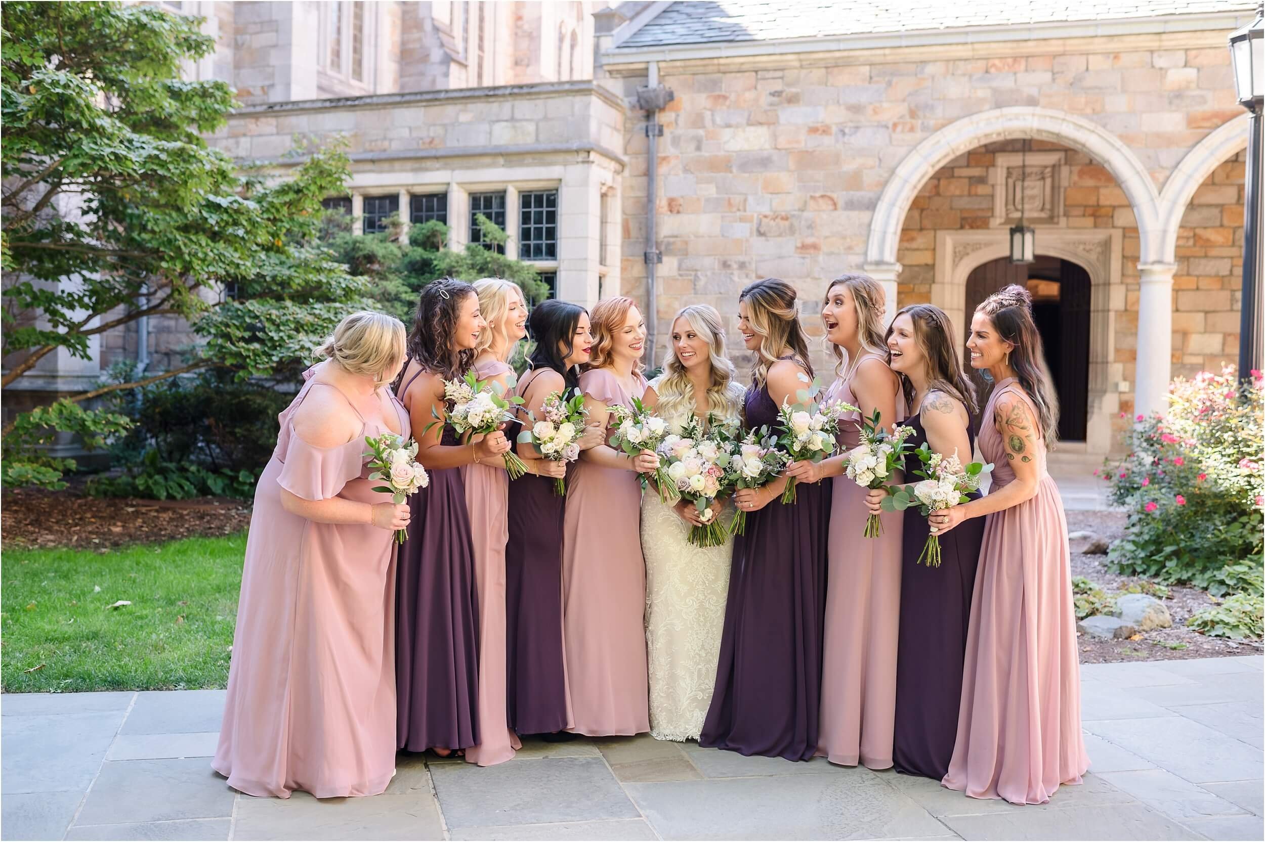  A group of bridesmaids talking in the University of Michigan law quad during their friends wedding.  