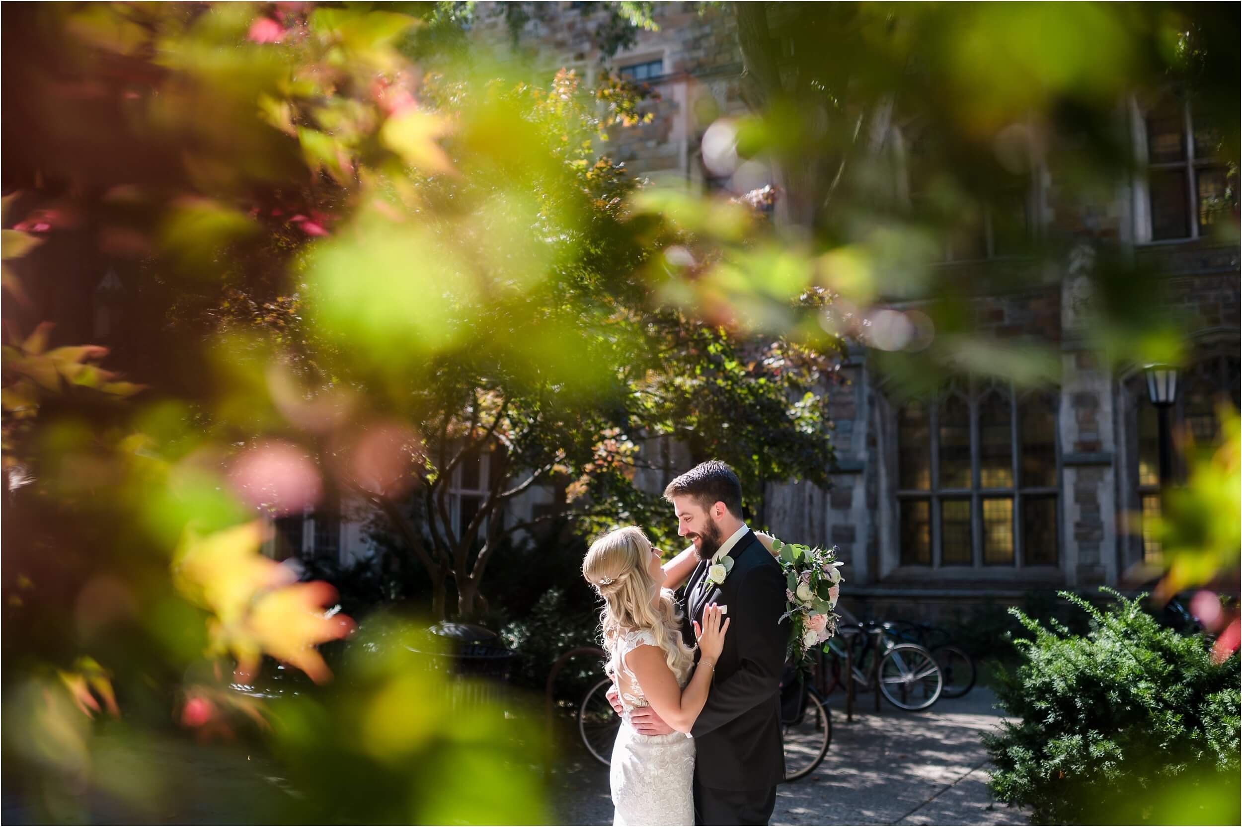  A couple embraces at the U of M law quad during their wedding photos.  