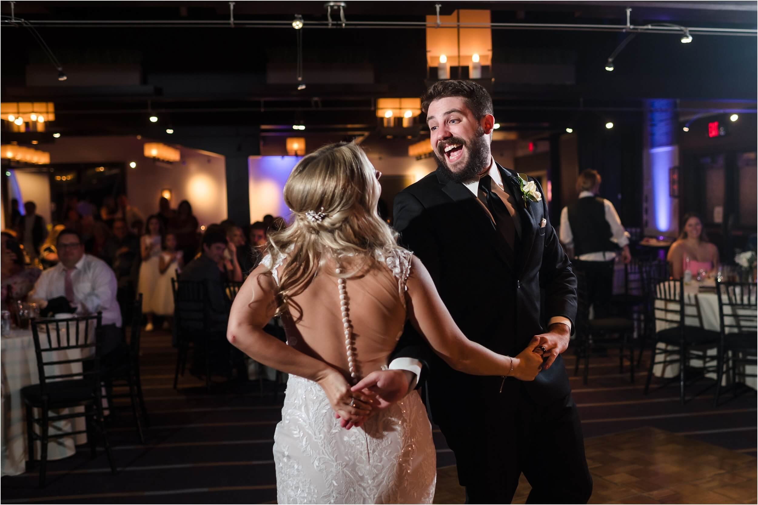  A couple spins enthusiastically during their first dance.  