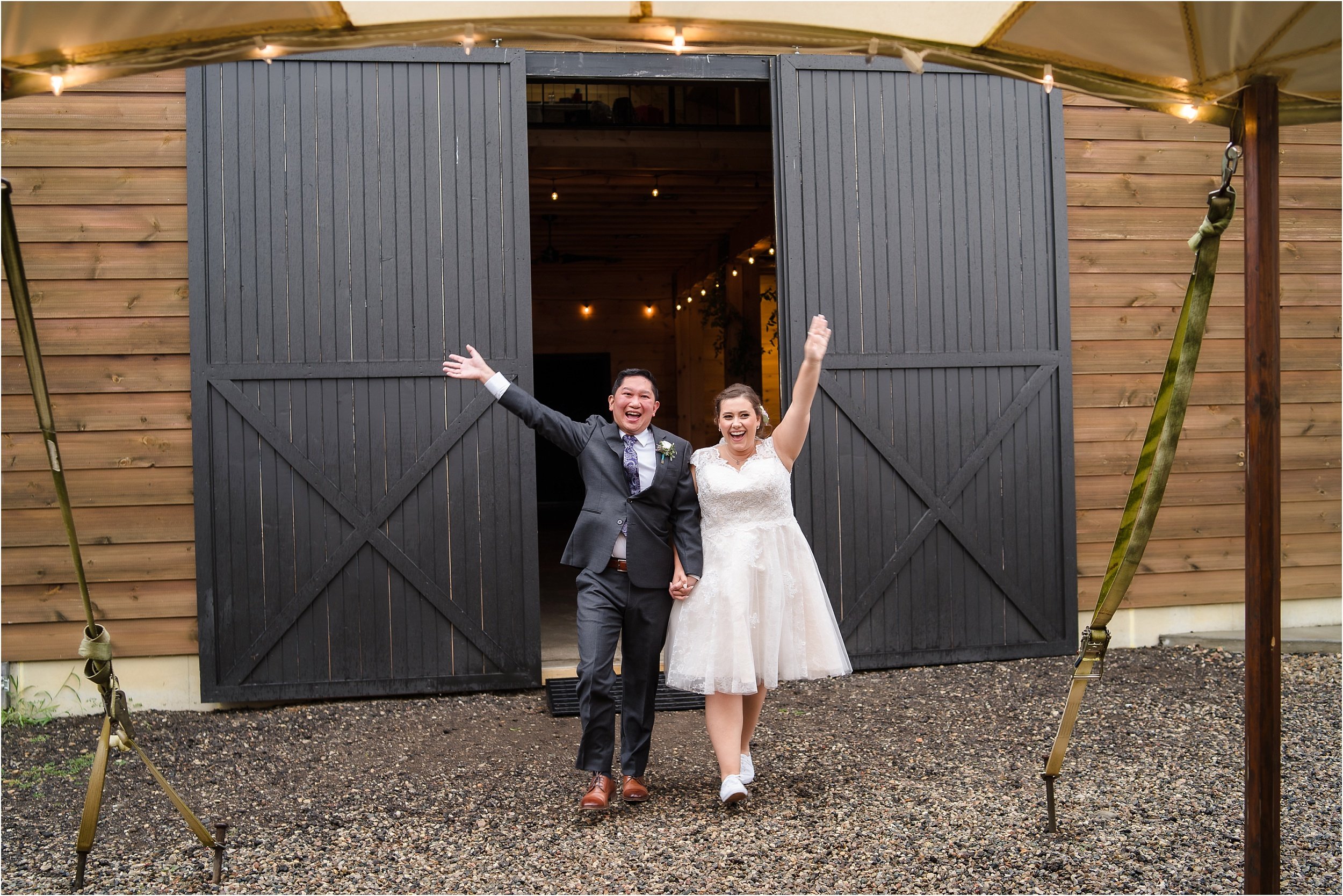  A couple enters their wedding reception.  