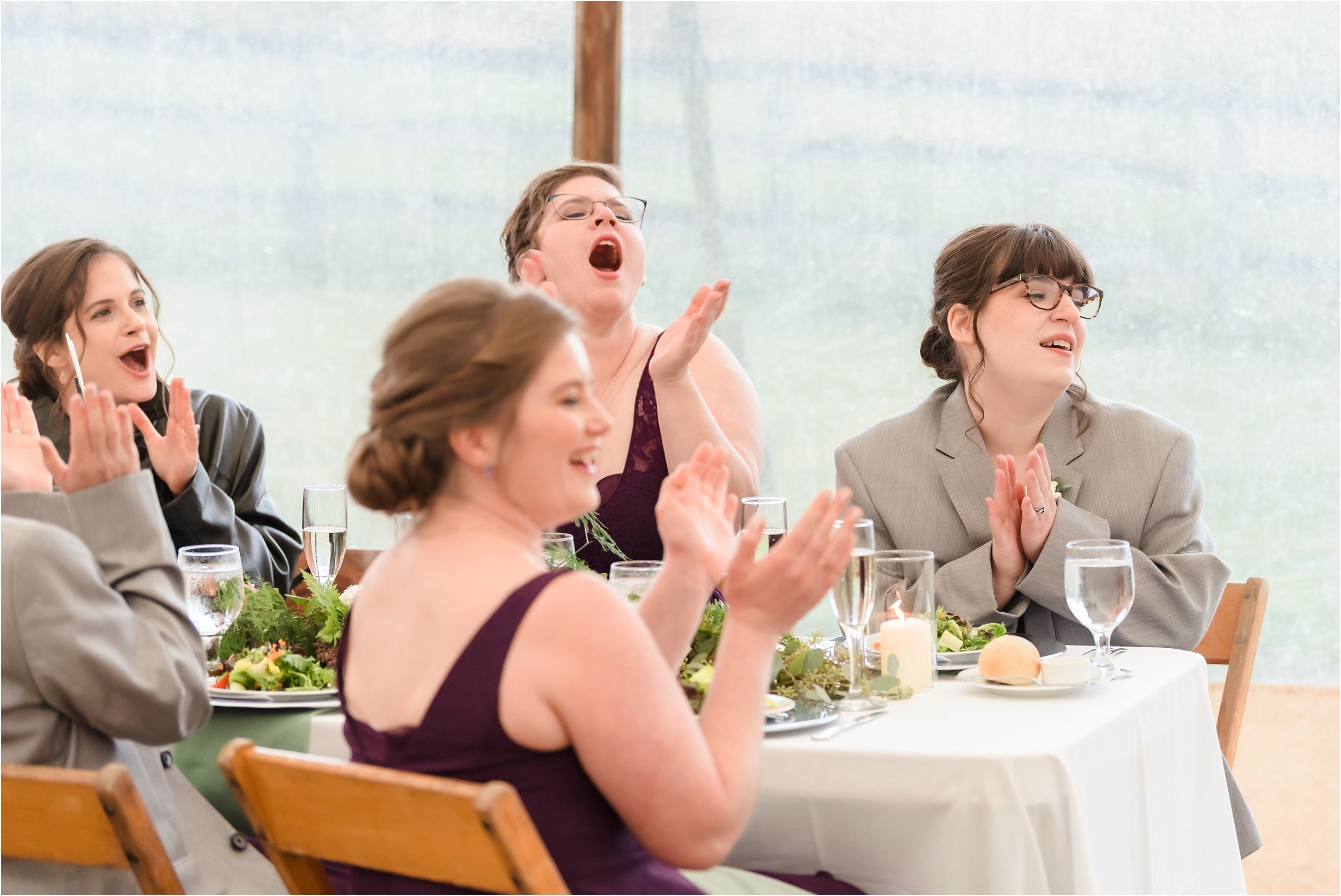  Wedding party members yell excitedly during toasts.  