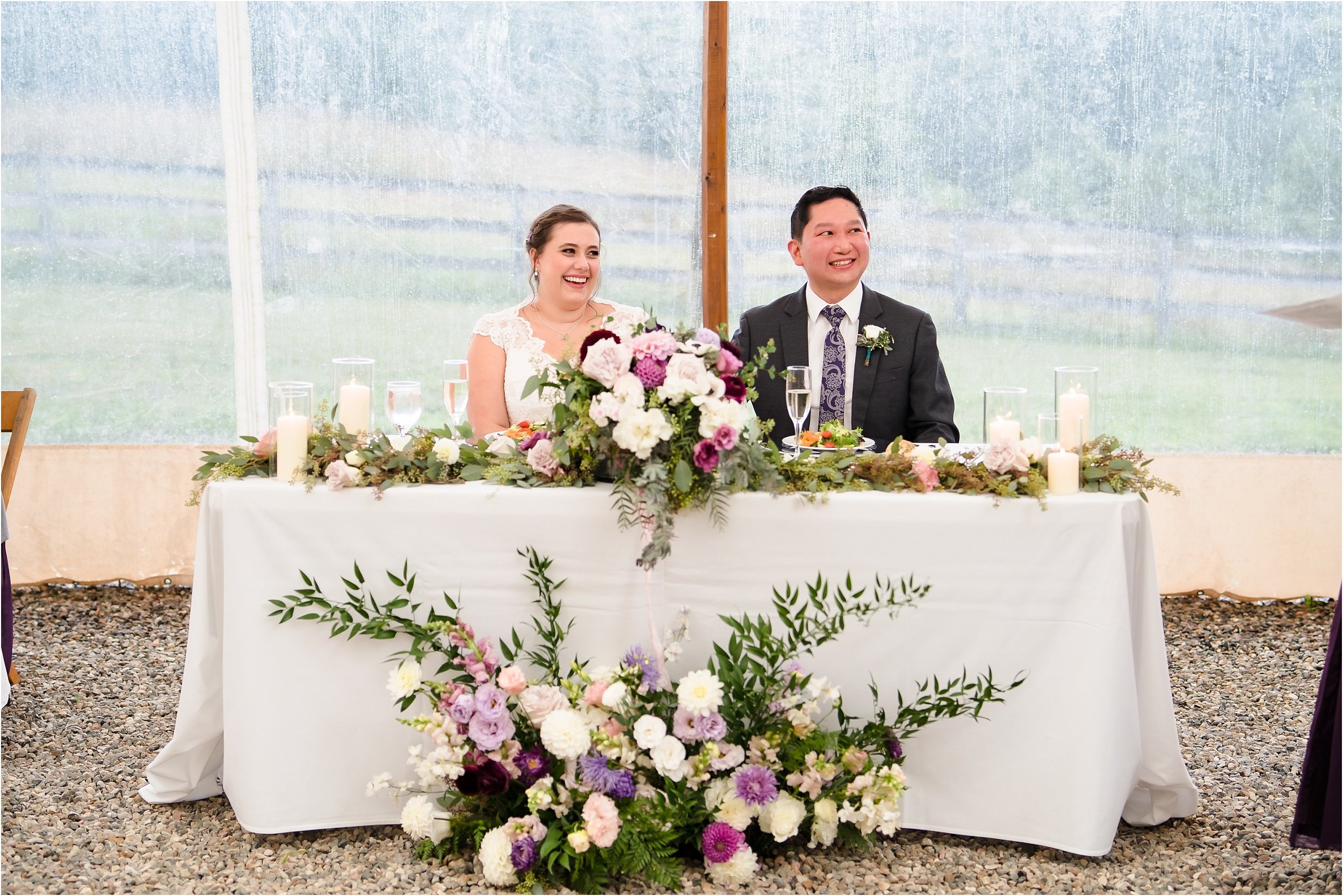 A couple listens attentively to speeches during their reception.