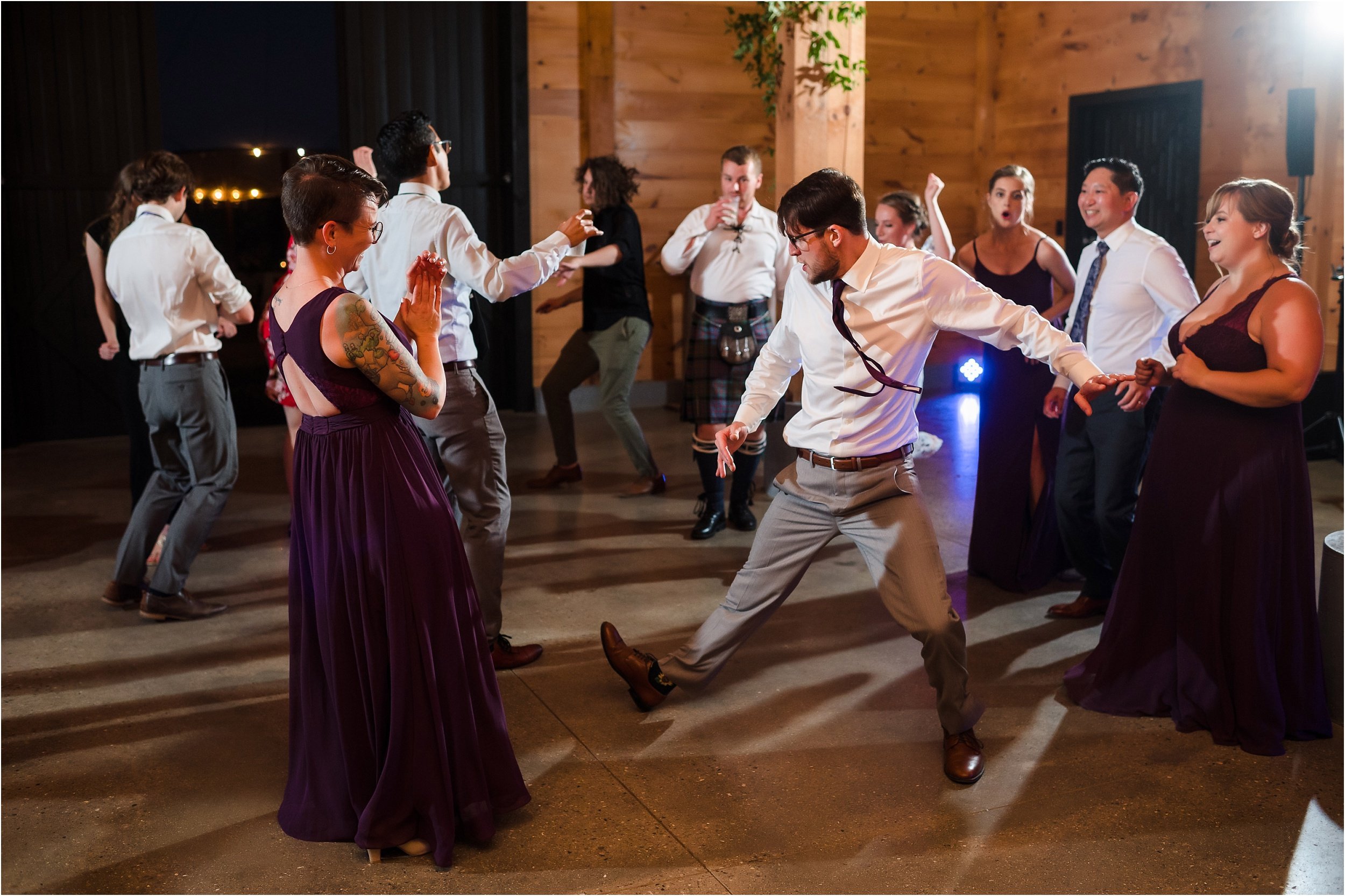  Guests at a wedding dance at a reception.  