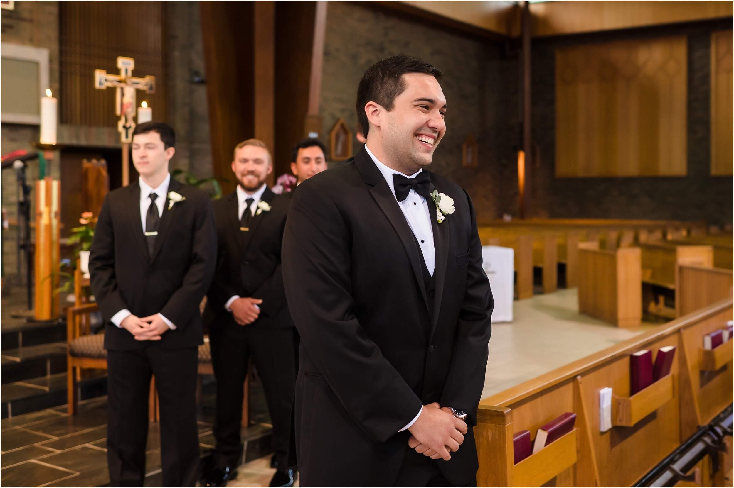  A smiles at his bride coming down the aisle at St Francis of Assisi Church in Ann Arbor.  