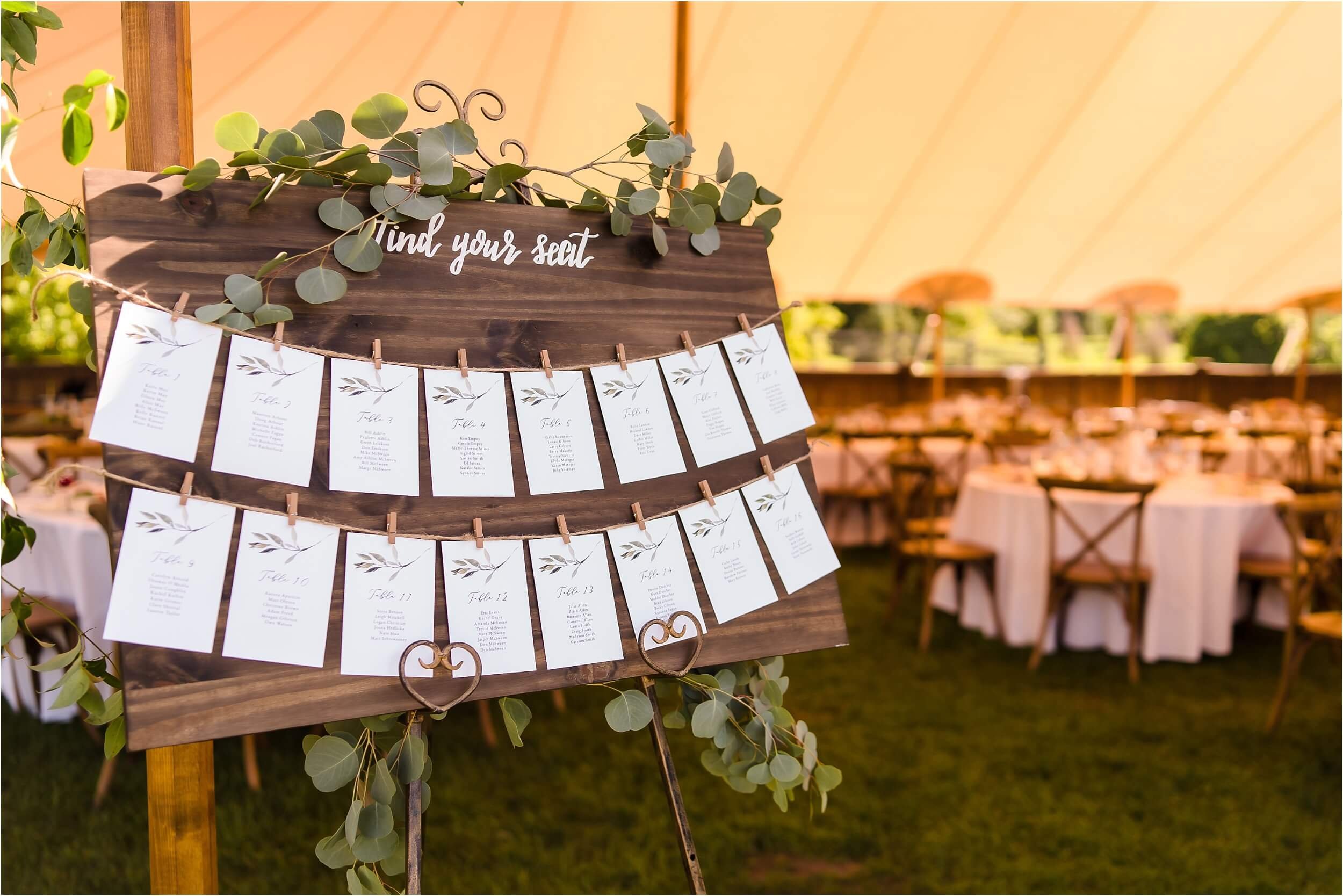  A rustic seating card display in front of a Ann Arbor tented reception.  