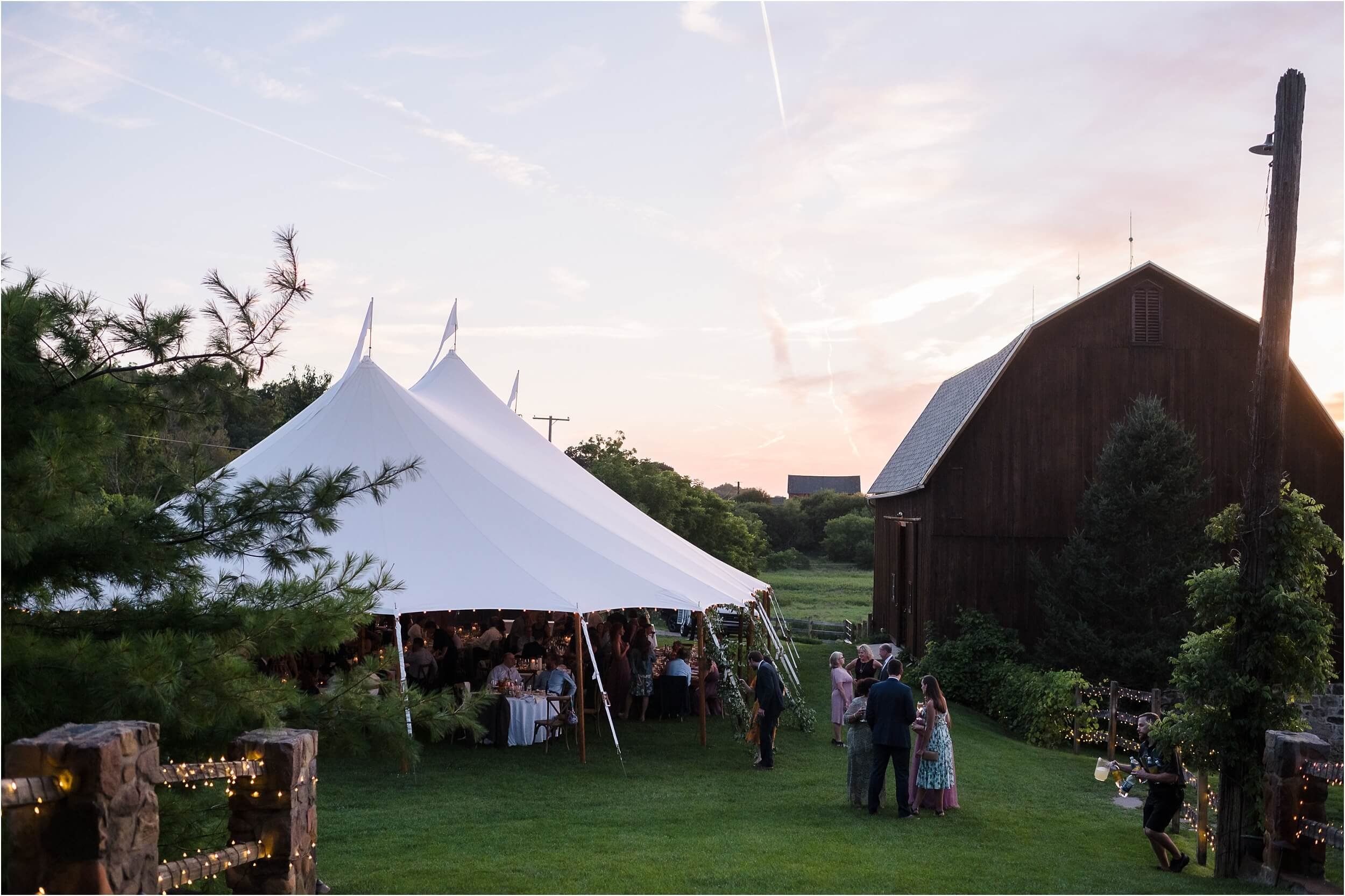  A rustic tented barn reception at a Michigan wedding venue.  