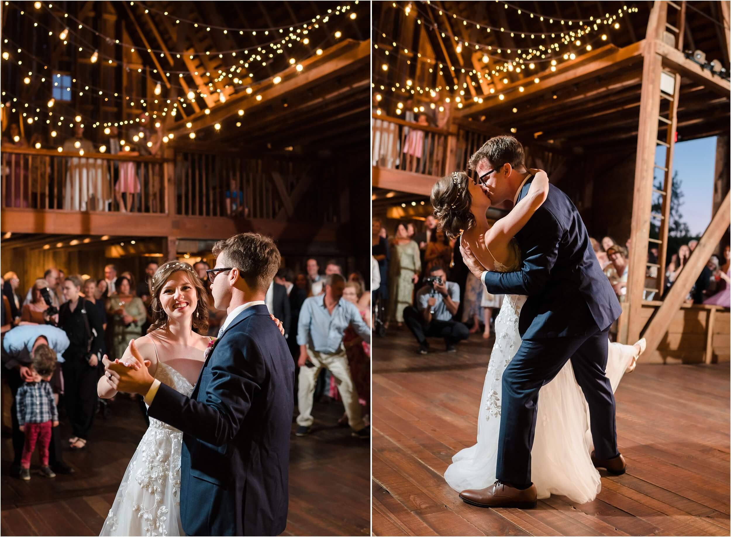  A couple shares their first dance under twinkle lights in a rustic barn venue.  