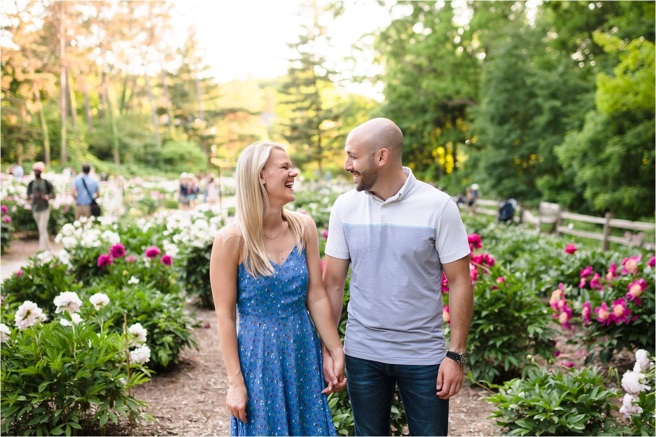  A couple laughs together during their evening engagement session. 