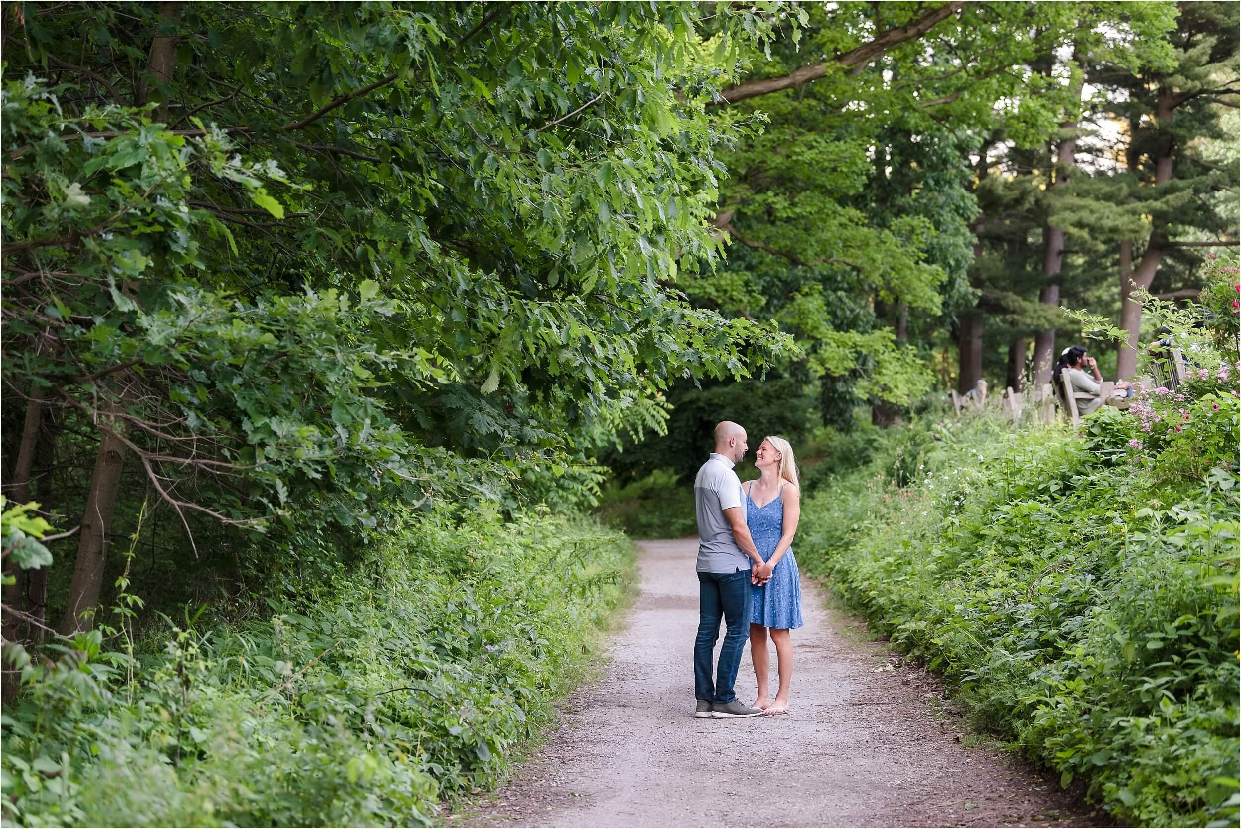  A couple holding hands during their engagement session. 