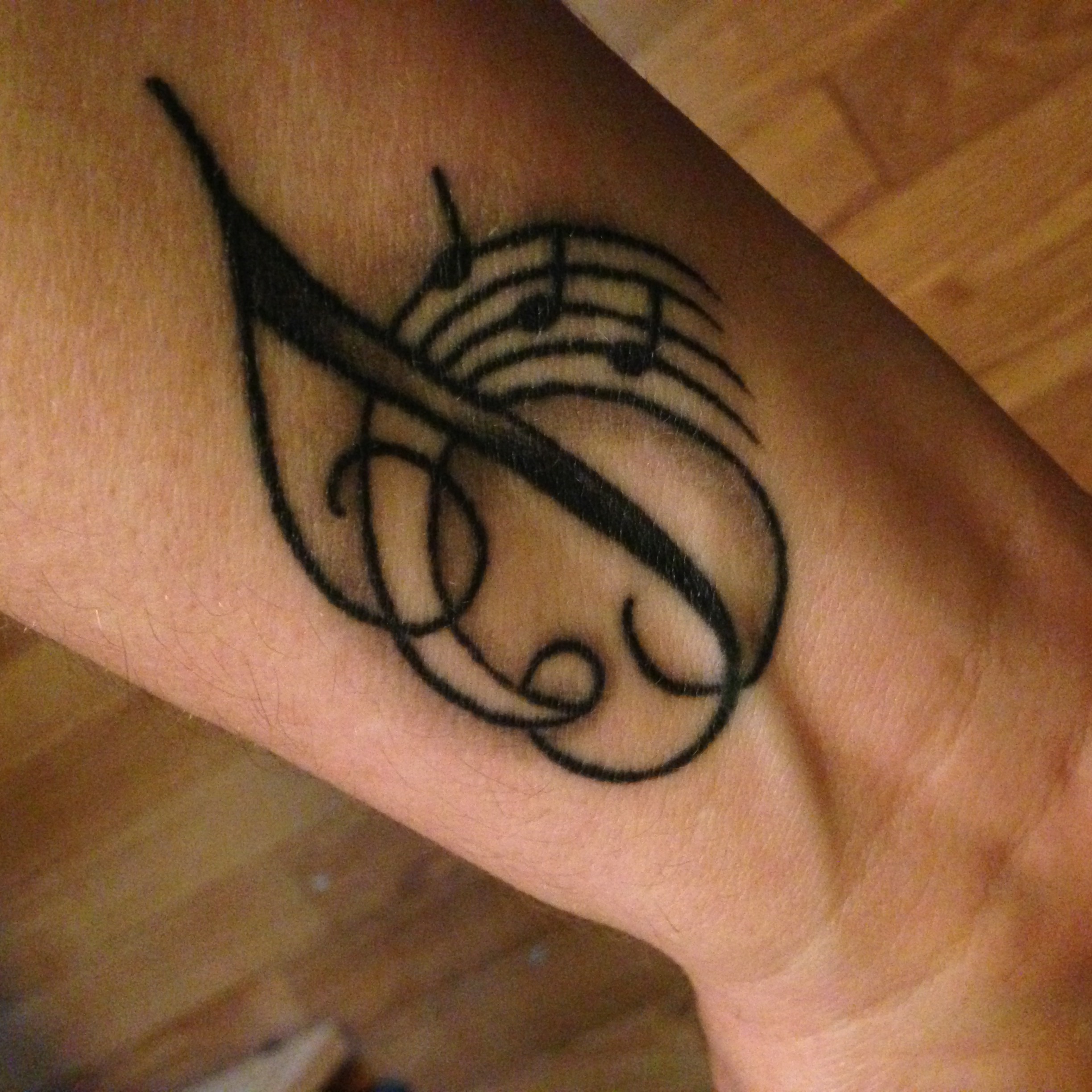 The J is for Jessie…she's kinda my hero, I guess…the three music notes are for Jessie, Josh and Jacob :)
