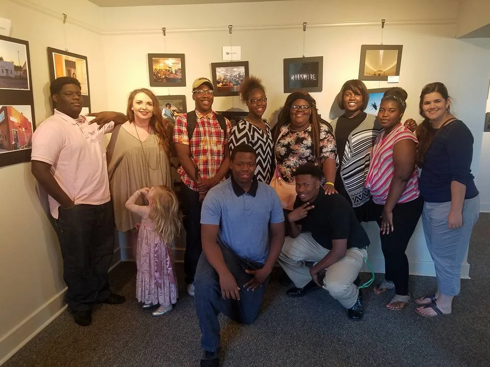 Group picture of Lane Riley, Director of DHH, and the youth who participated in this event.