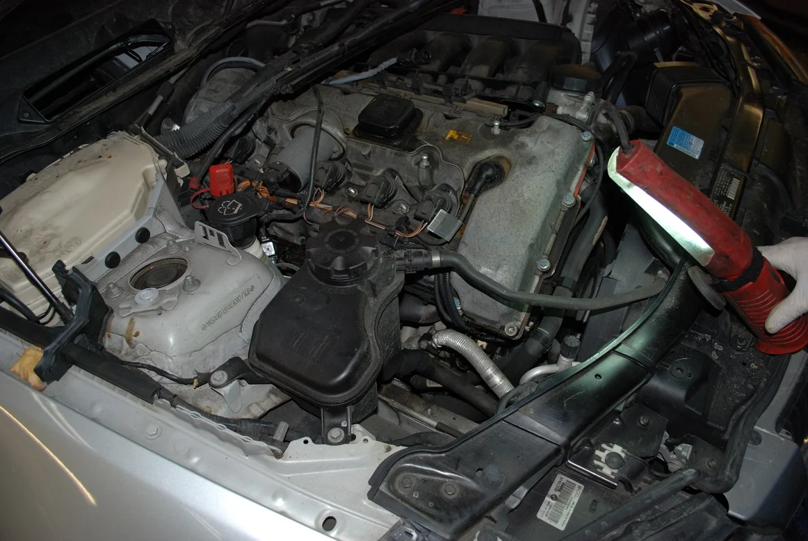 325xi oil leaks and starter.jpg