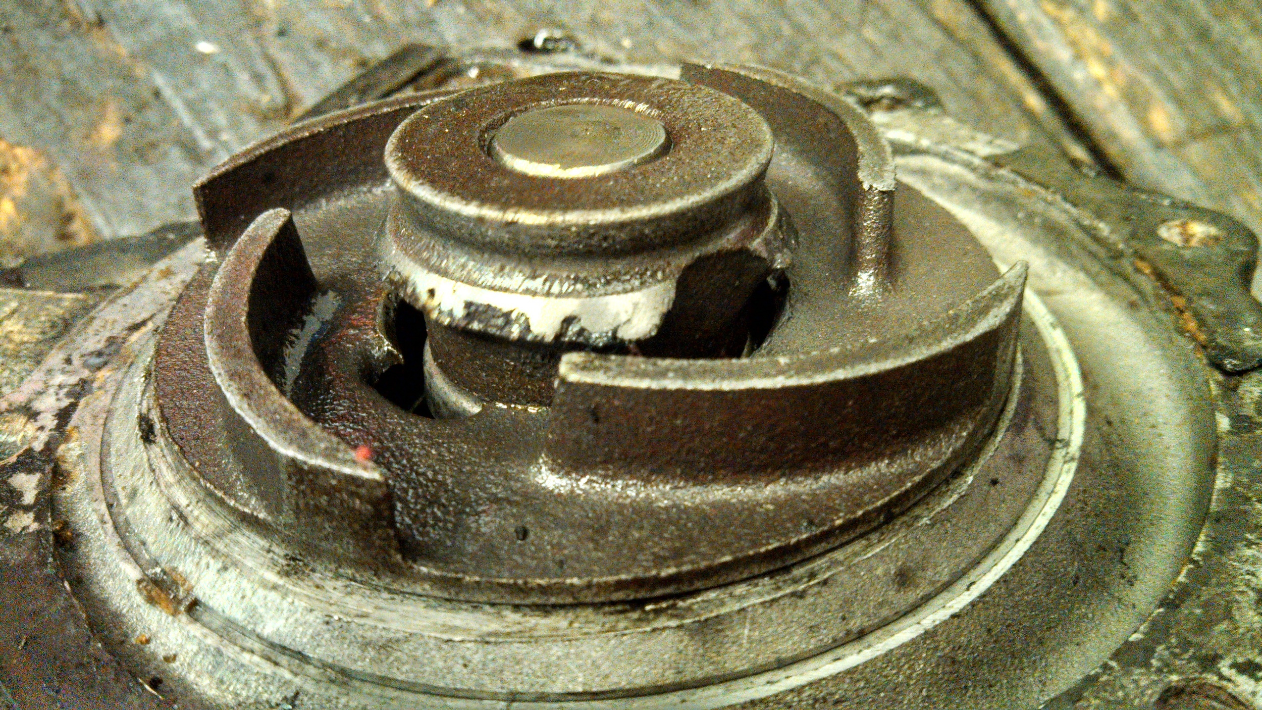 Upon closer inspection, it is clear that the impeller has completely separated from the shaft. Not good for coolant circulation. This car did over heat and was well over the recommended maintenance interval. Unfortunately, she was so far gone, the car could not be saved.