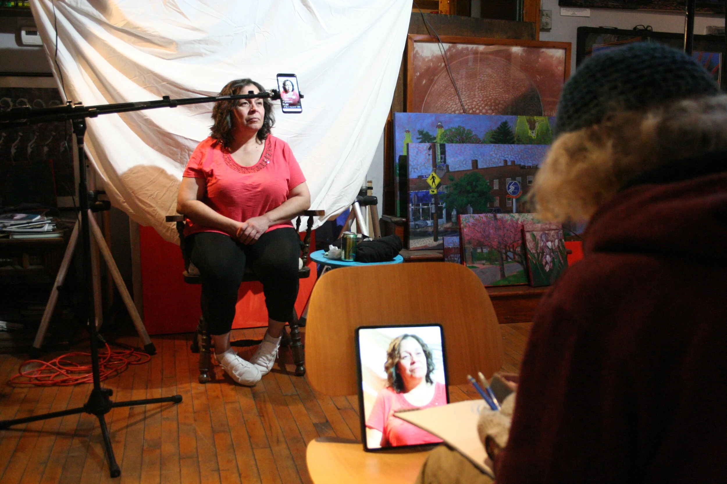 Larry Zuzik drawing Aileen. Photo by Brian Pierce