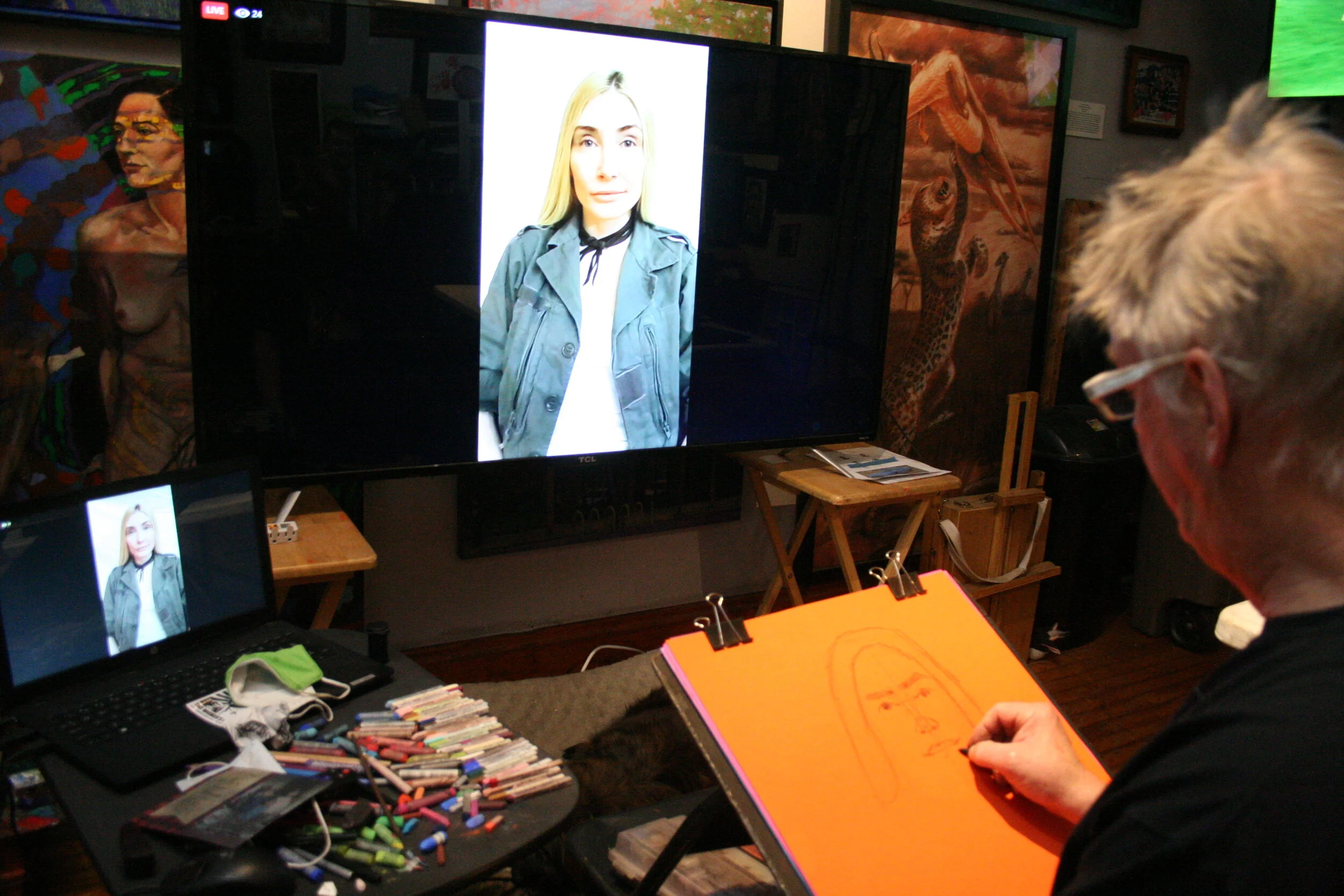 Timothy Herron drawing from the tv. Photo by Brian PIerce.