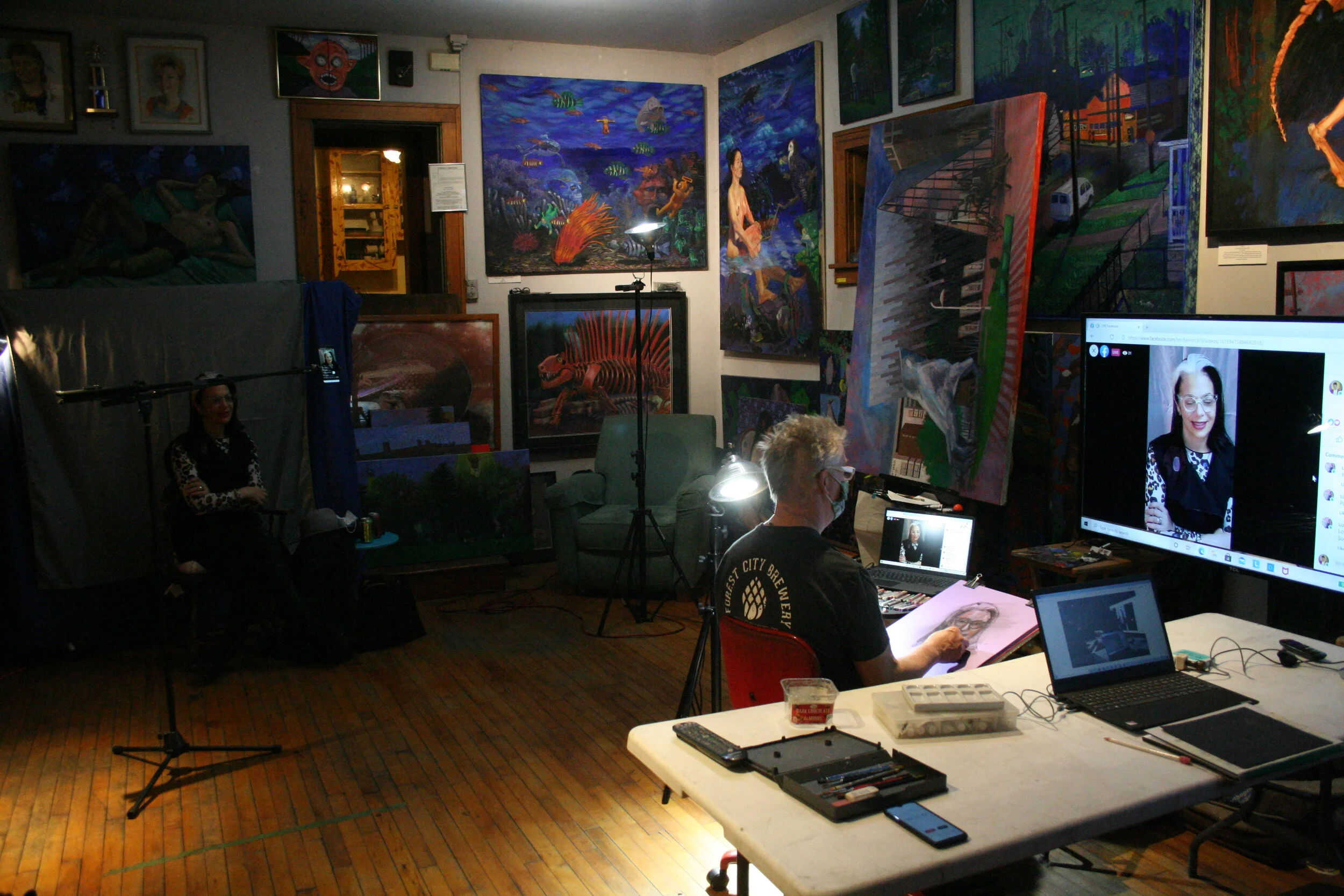 Lara posing in the dark and Timothy Herron drawing from the flat screen. Photo by Brian Pierce. 