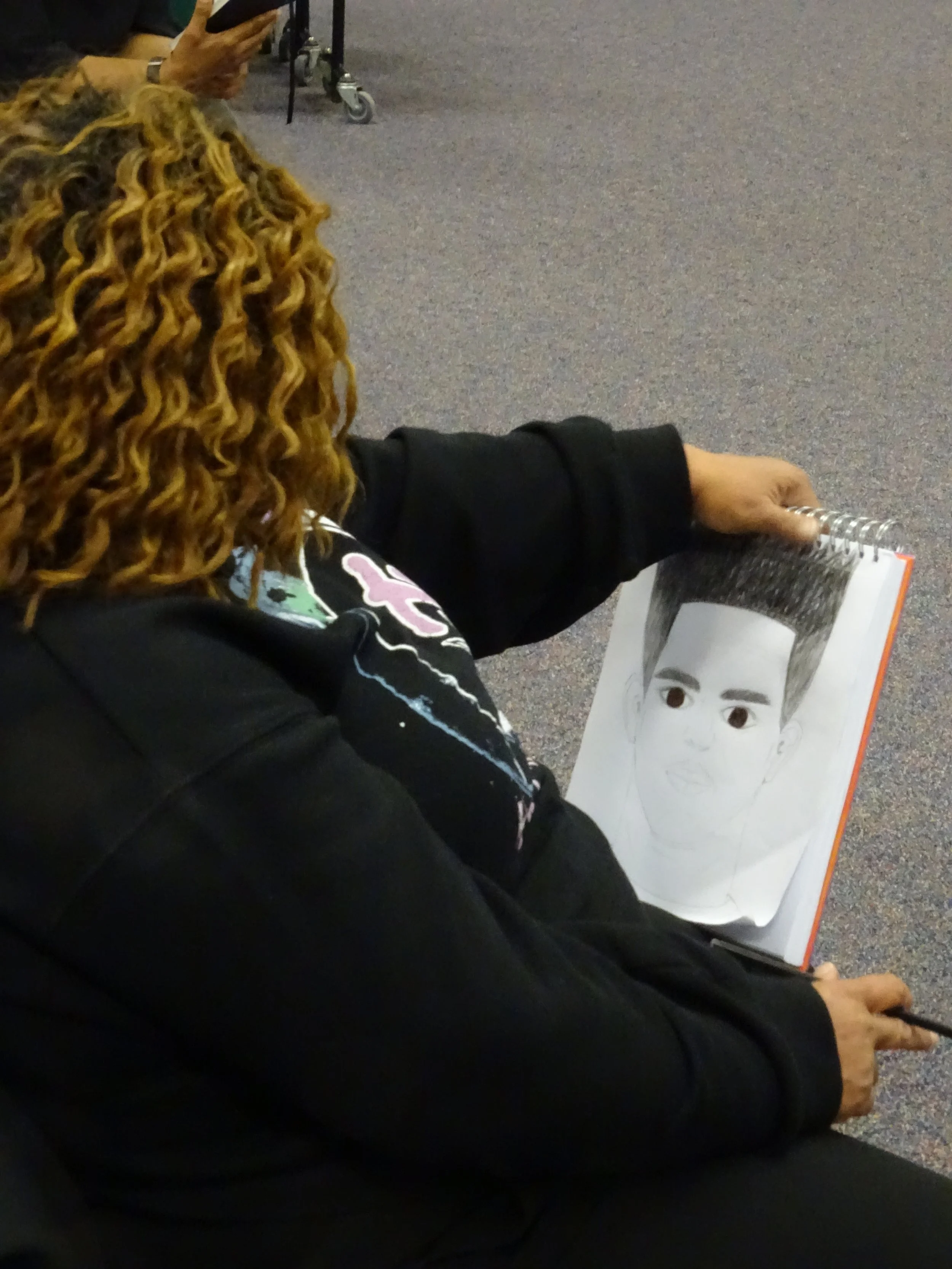 Starr Price drawing her son 