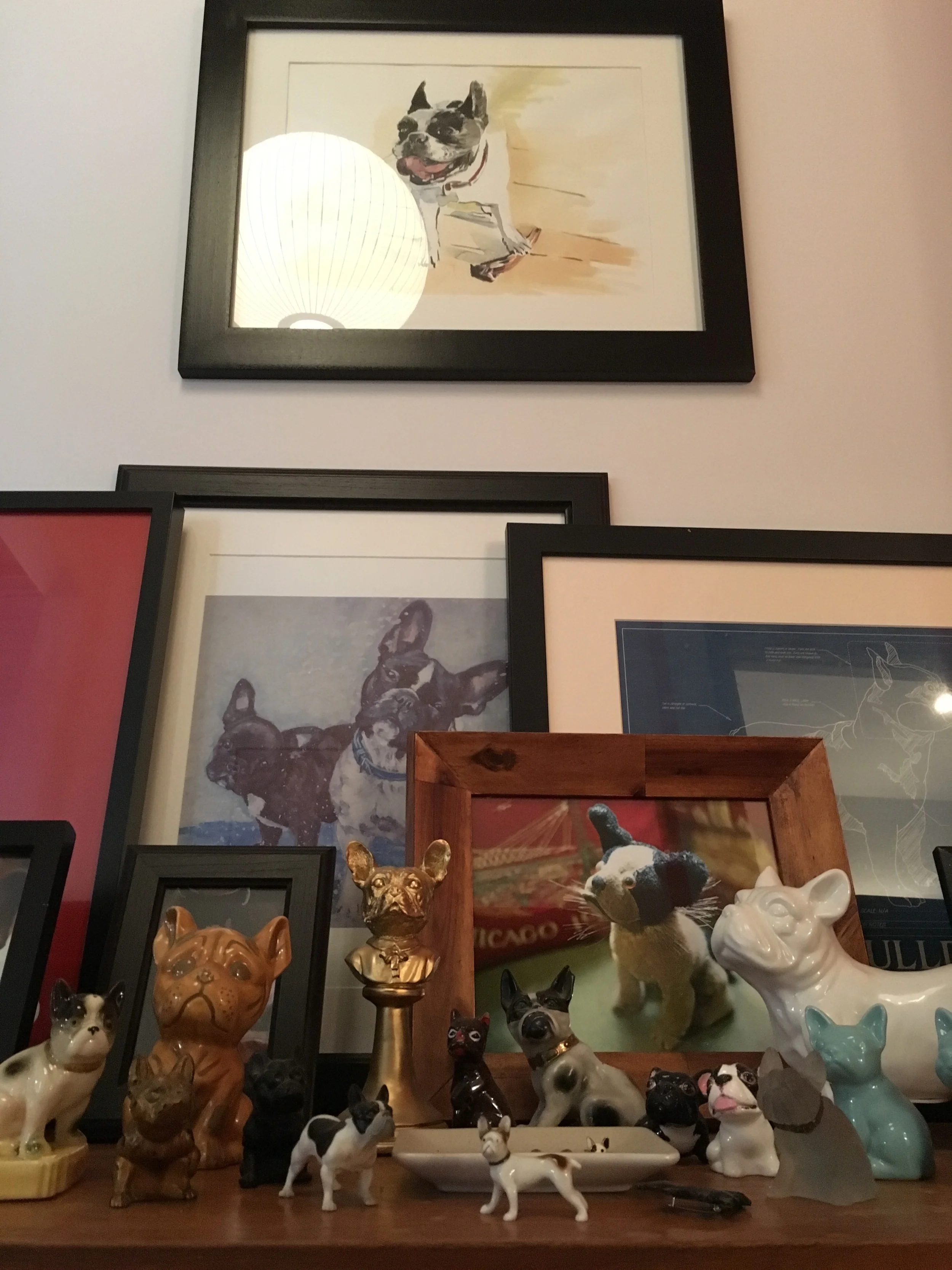 This is the Frenchie Shrine in my house. Most of the artwork and objects are gifts from friends. At the top is a beautiful watercolor portrait of my dear, sweet late Frenchie Prue by Dmitry Samarov. It's not hoarding if it's organized, right? 