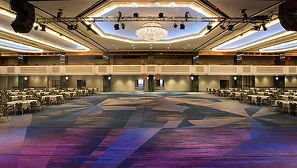 Within one of Manhattan’s largest hotels, the New York Hilton Midtown , is Manhattan’s largest hotel ballroom, which features an over-the-top crystal chandelier atop its newly renovated 25,000-square-foot Grand Ballroom.