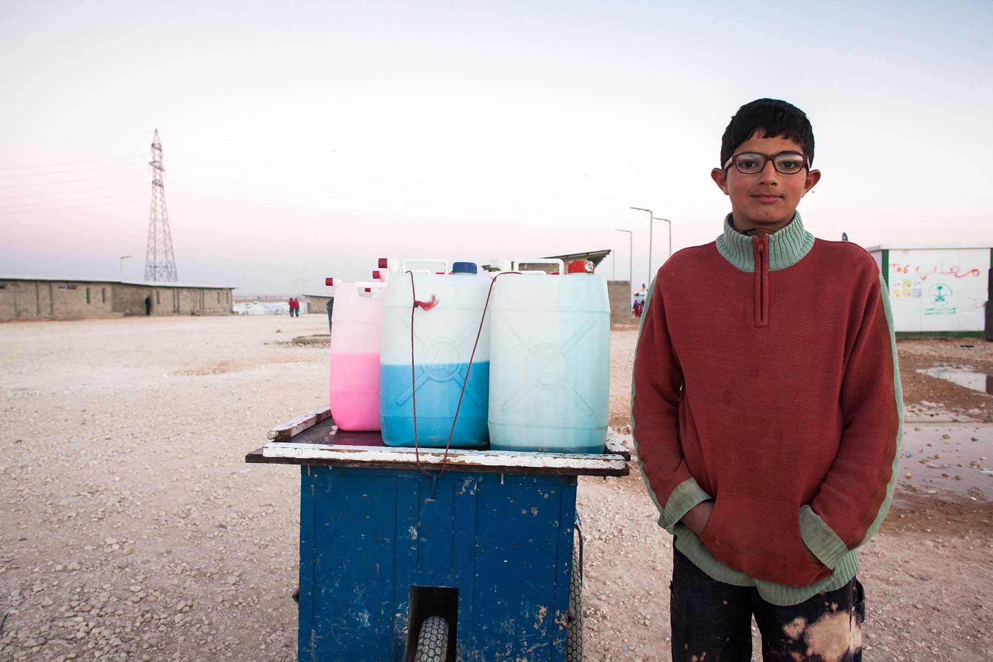  Yussef, 14 sells juice to his fellow Syrians at Zaatari.&nbsp; 