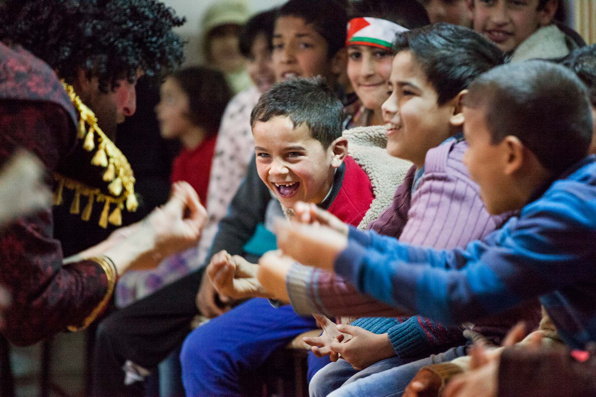  A young Syrian boy caught up the excitement of a Clowns Without Borders performance in the town of Mafraq, Jordan. 